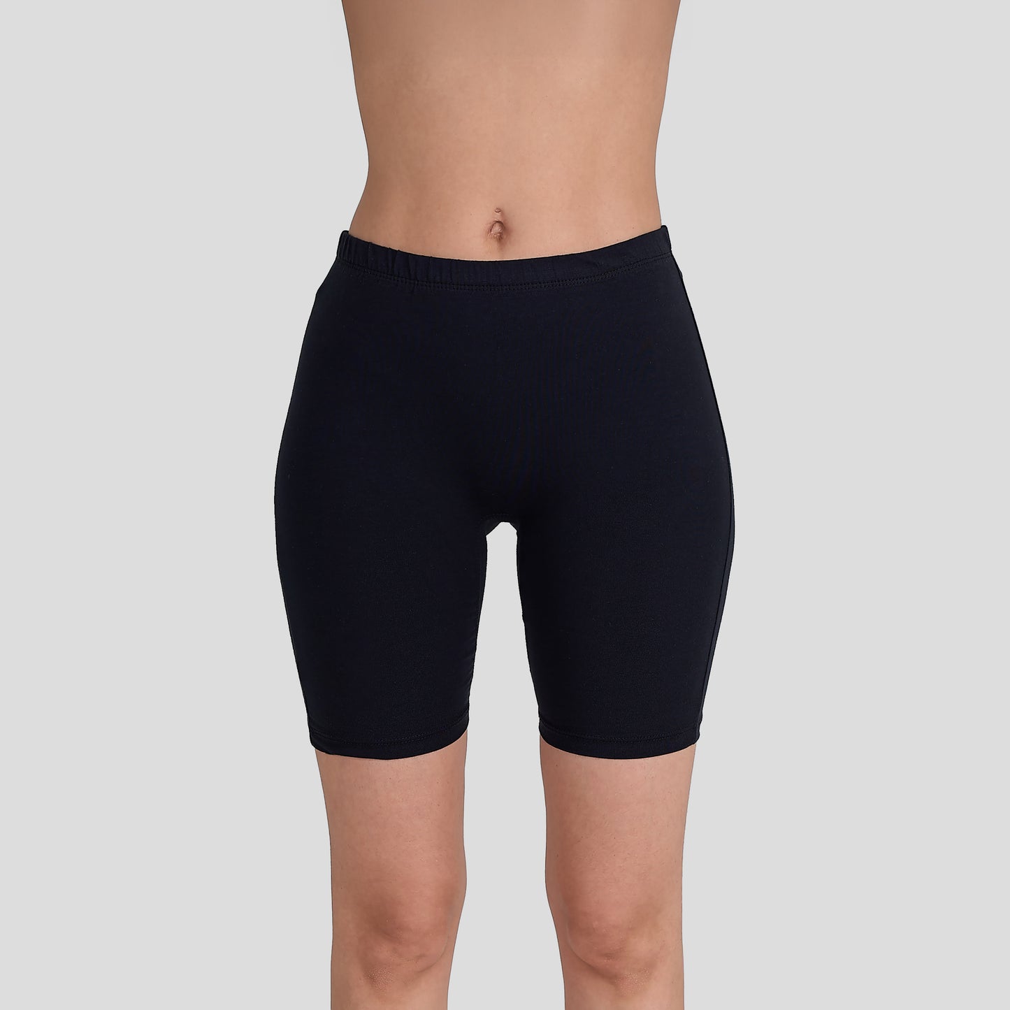 Dice Black shorts worn by a person on a light gray background
