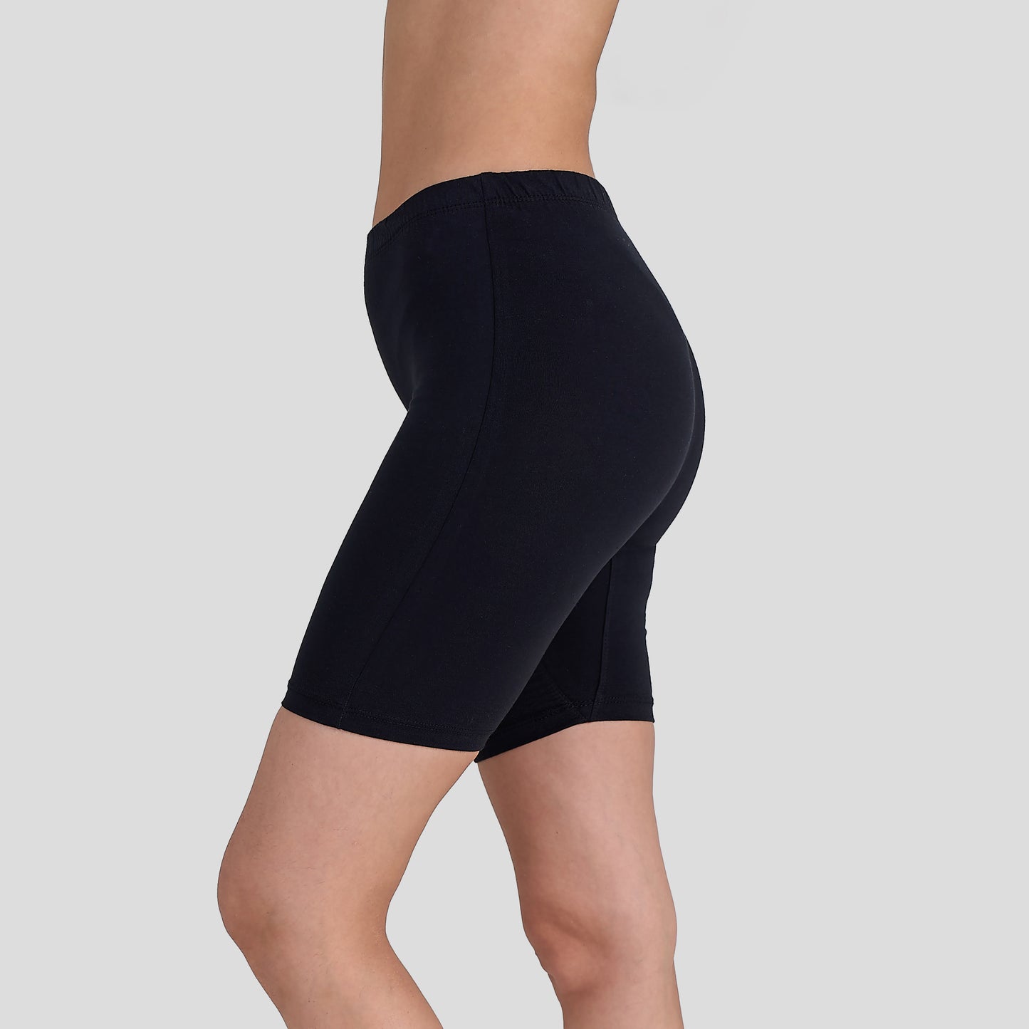 Dice Black athletic shorts worn by a person on a light gray background