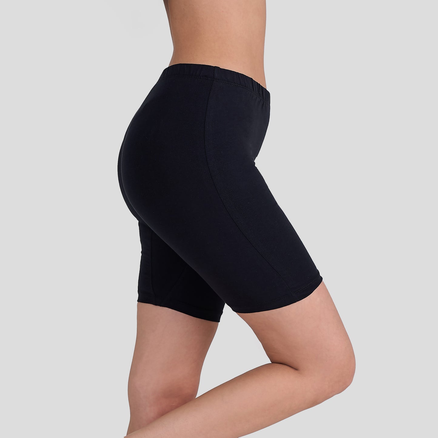 Dice Black athletic shorts worn by a person on a light gray background