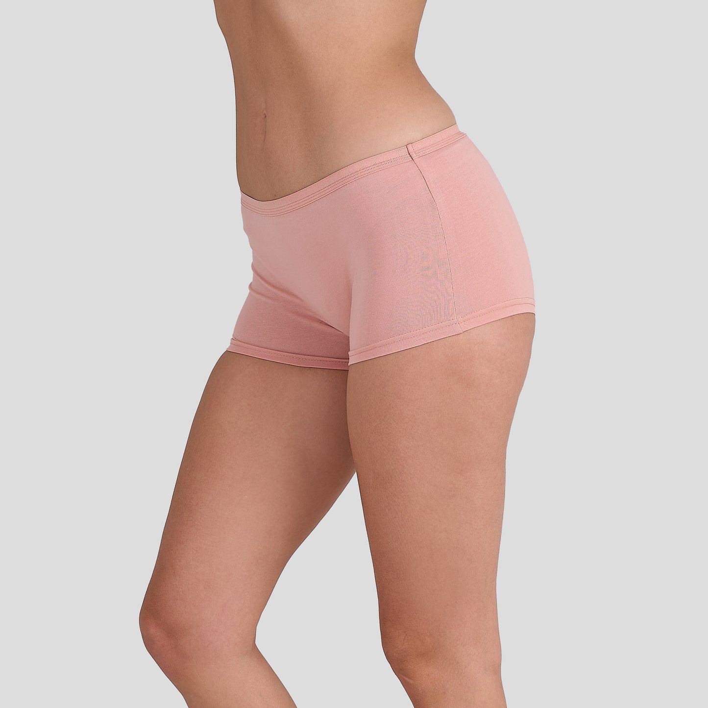 Dice women underwear pink shorts on a plain background