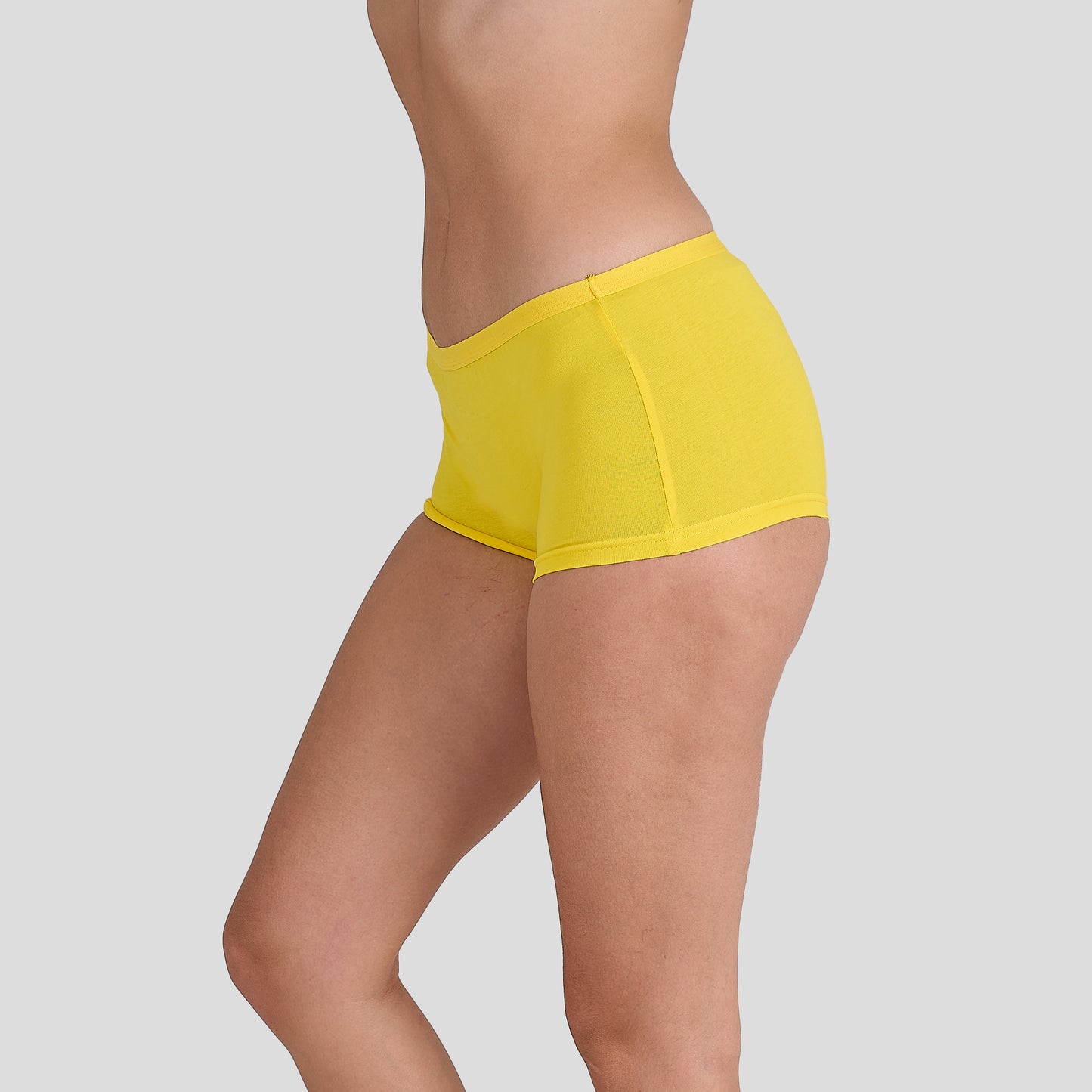 Yellow athletic shorts Dice women underwear on a plain background