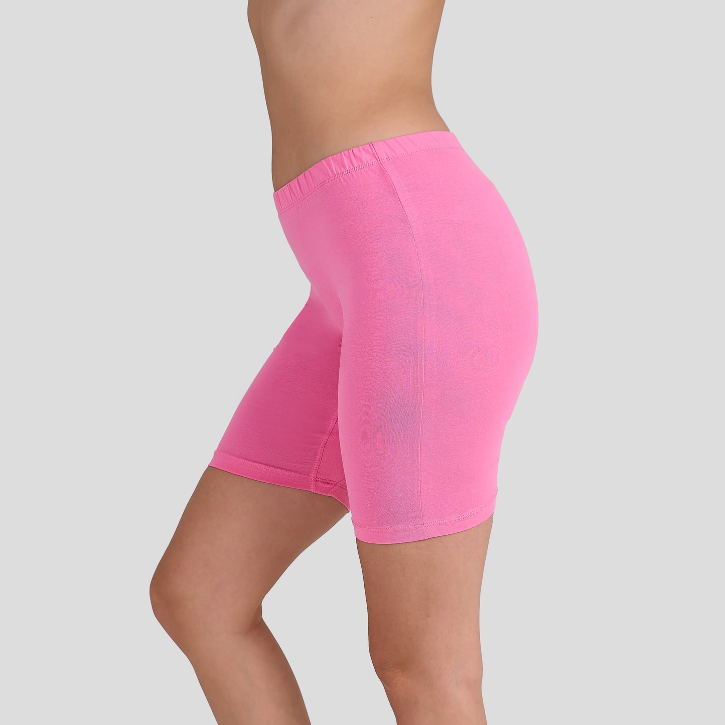 Dice Pink athletic shorts worn by a person on a light gray background