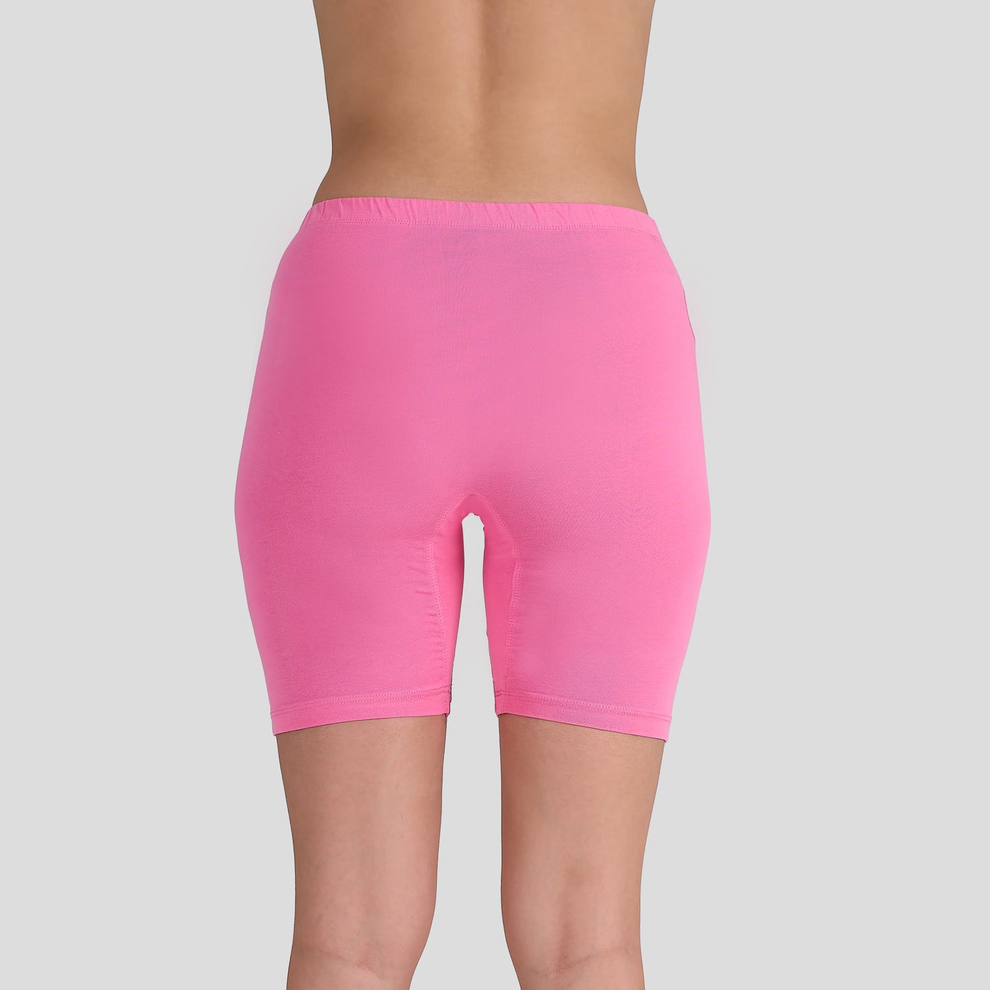 Dice Pink shorts worn by a person on a gray background
