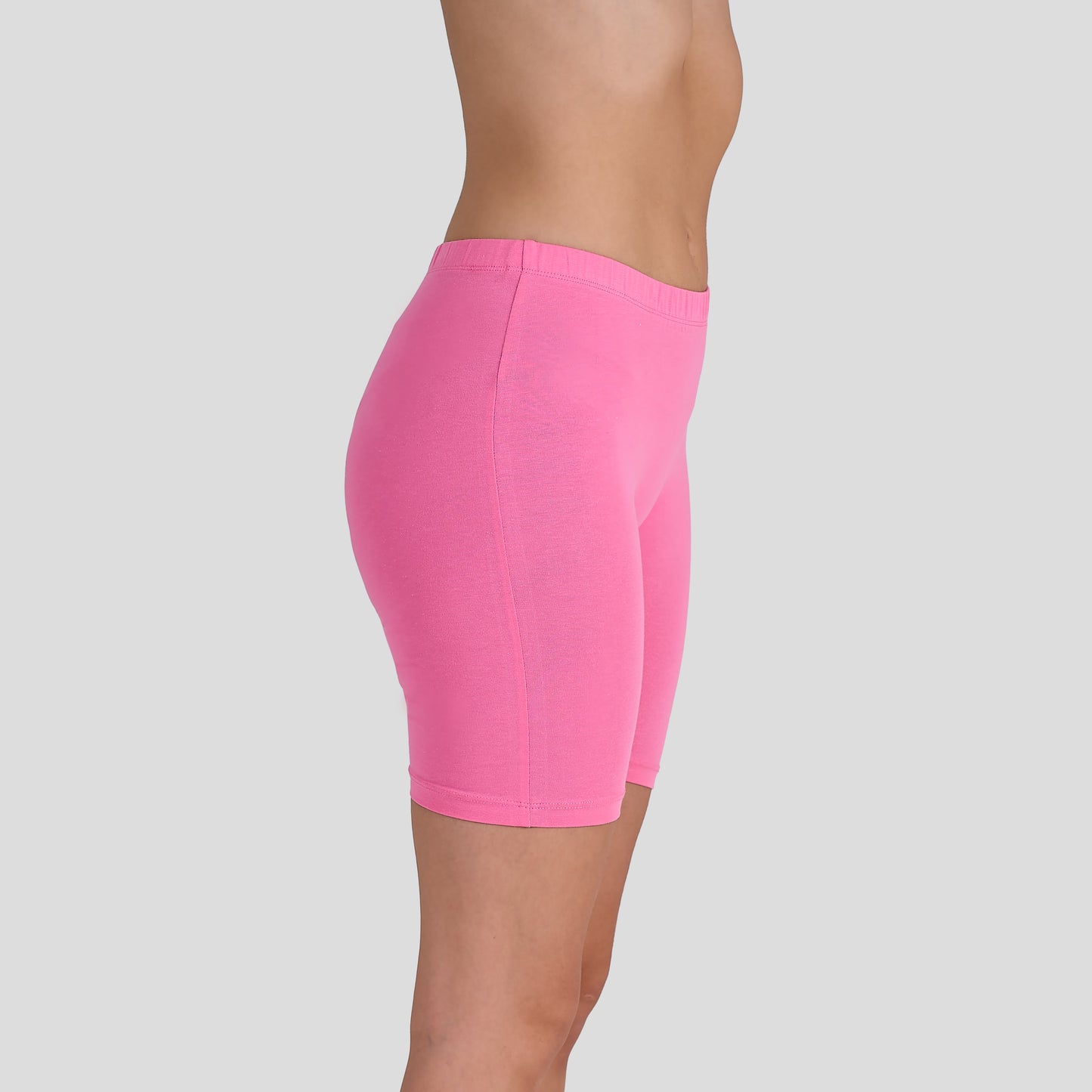 Dice Pink athletic shorts worn by a person on a light gray background