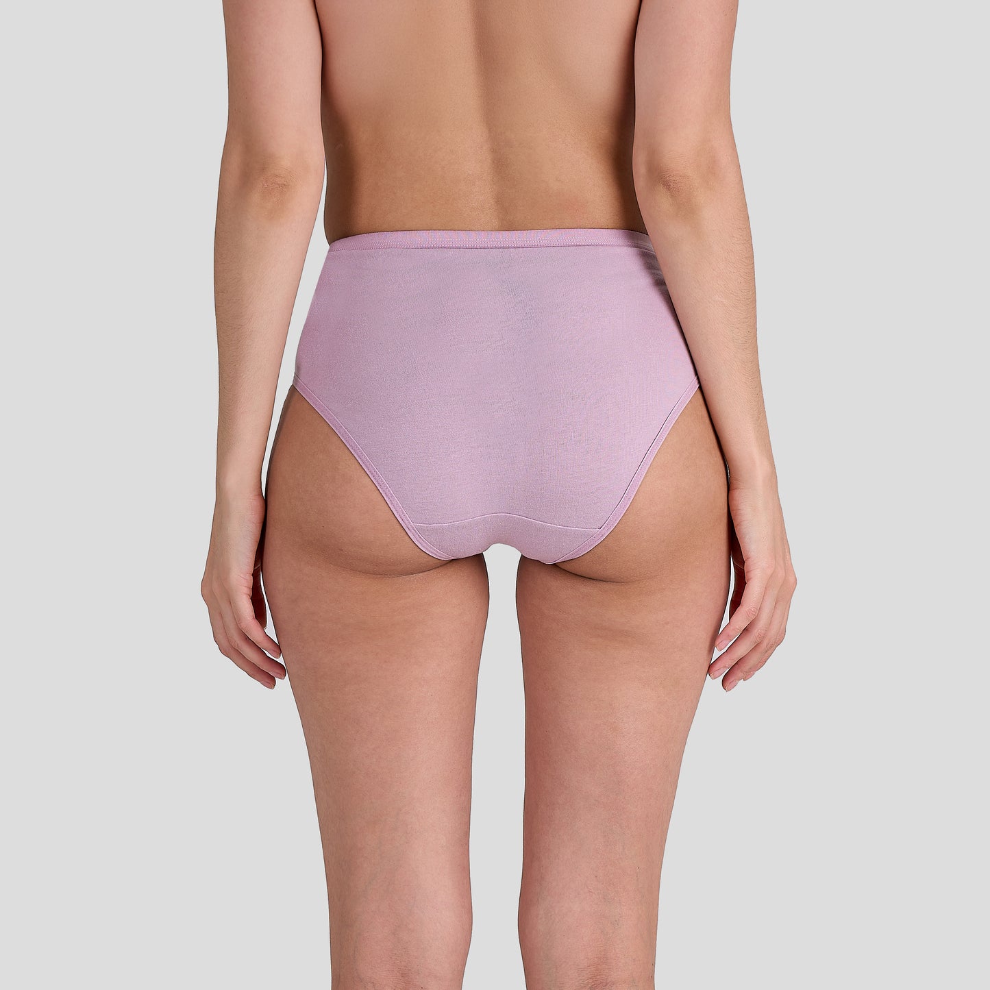 Person wearing a Dice light purple high-waisted bikini bottom on a plain background