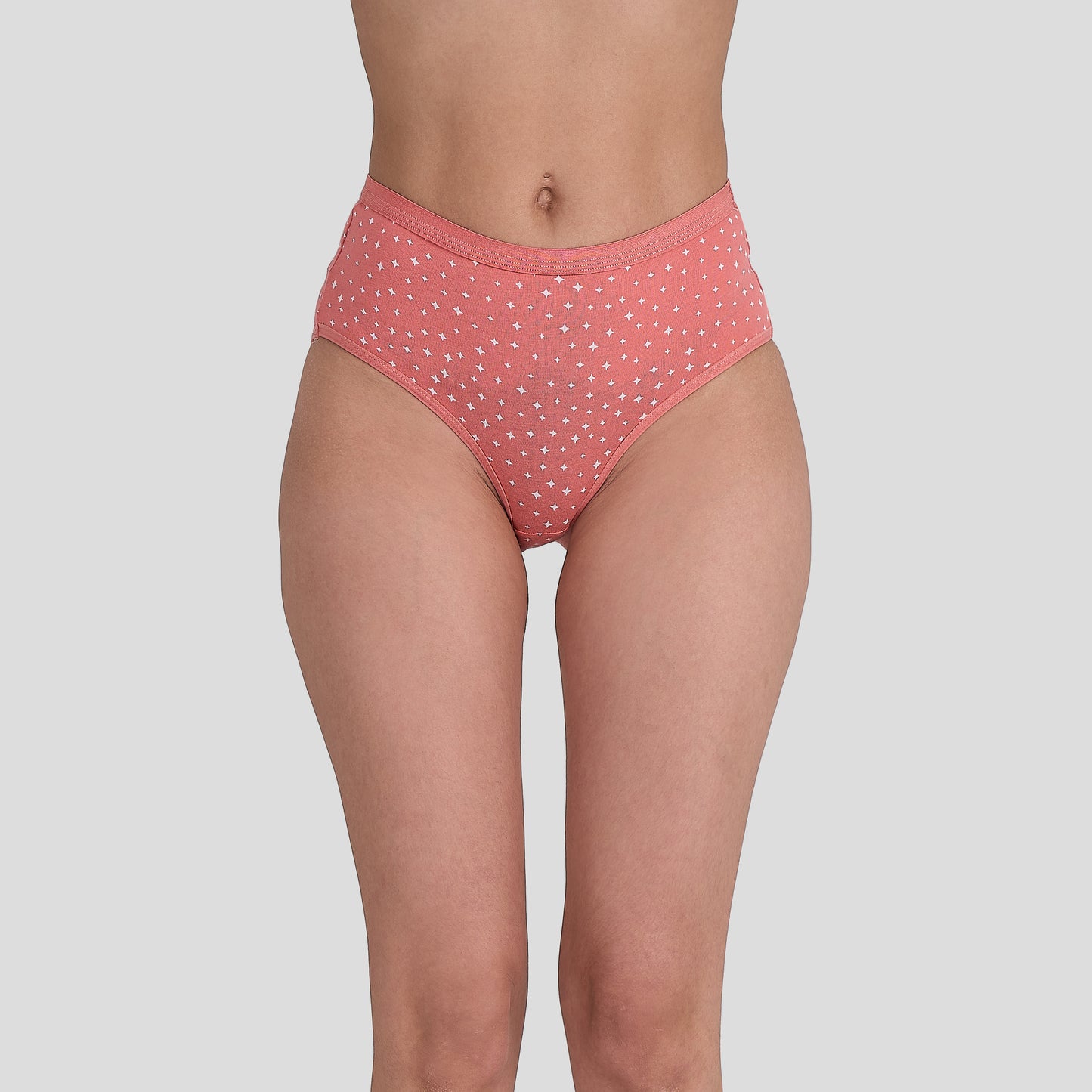 Dice Pink polka dot underwear on a plain background