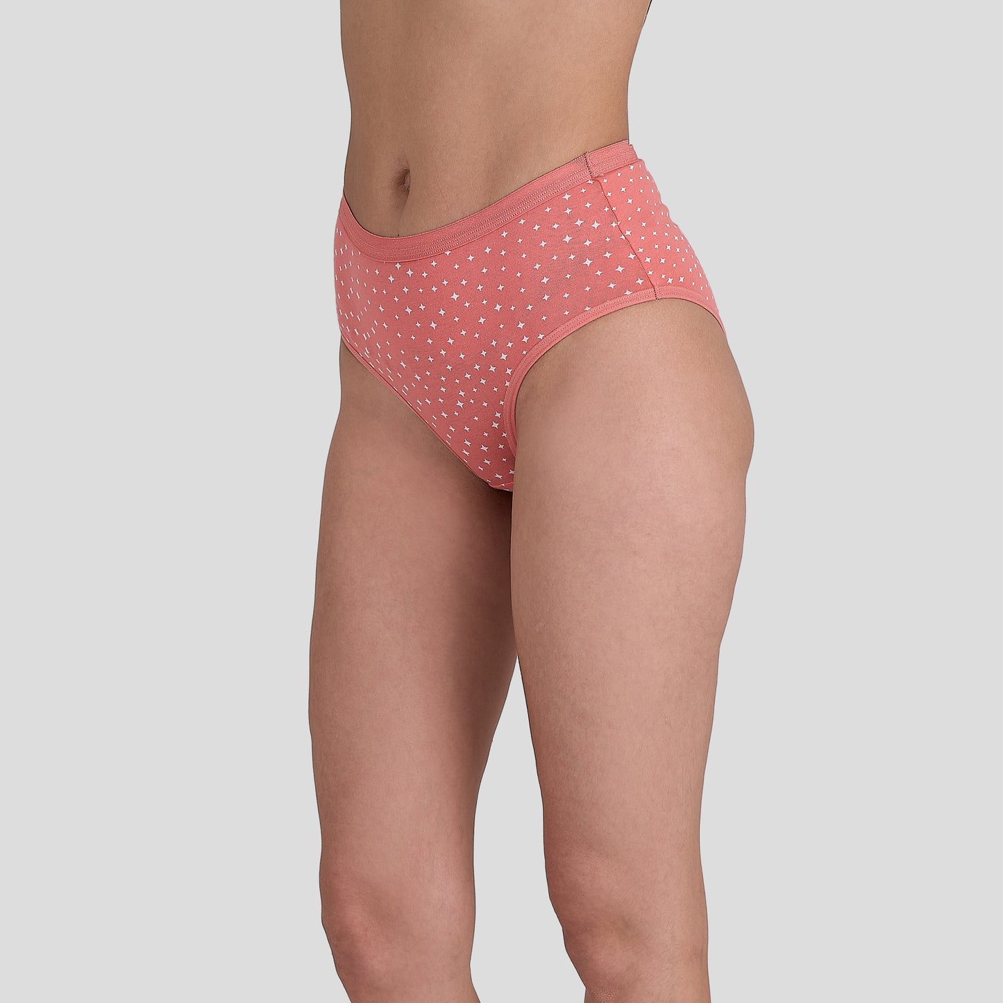 Dice Pink polka dot underwear on a plain background