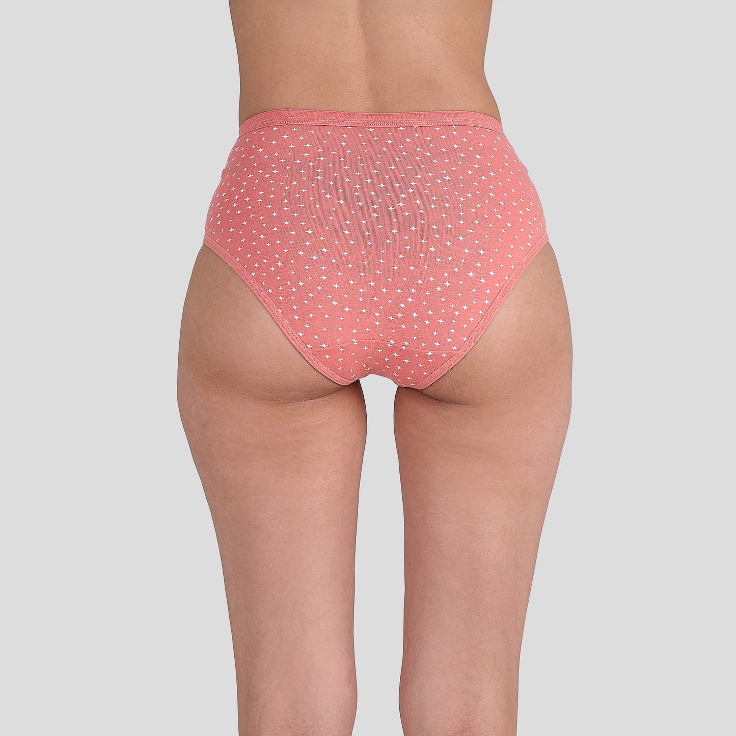 Dice Pink polka dot underwear on a plain background