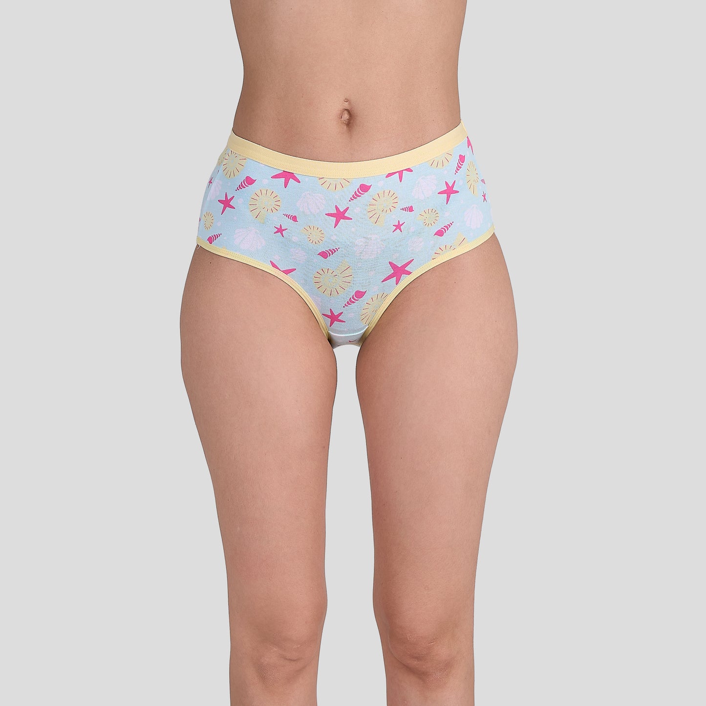 Dice Patterned underwear worn by a person on a plain background