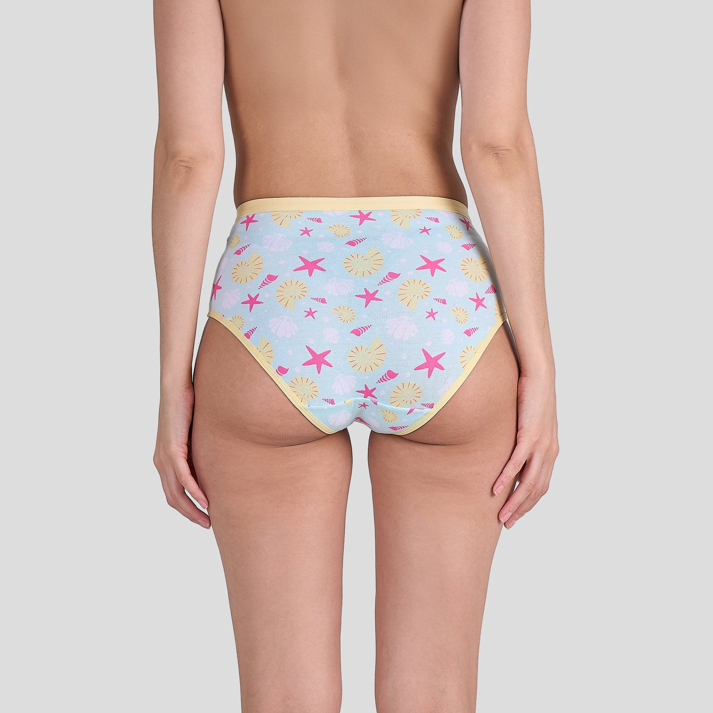Dice Pastel blue bikini bottom with starfish and shell pattern on a plain background