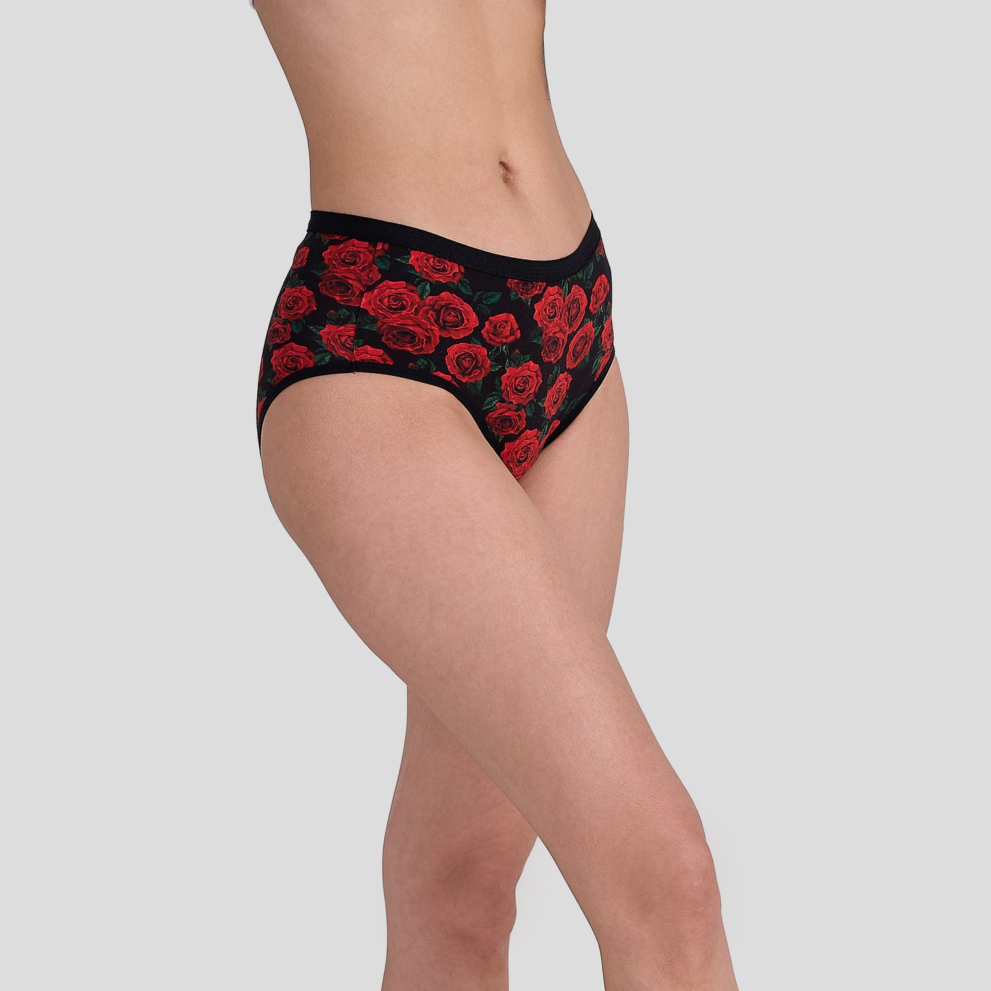 Dice Black underwear with red floral pattern worn by a person on a gray background