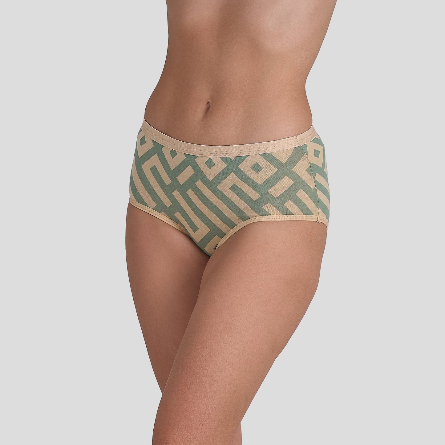 Dice Patterned underwear worn by a person on a plain background
