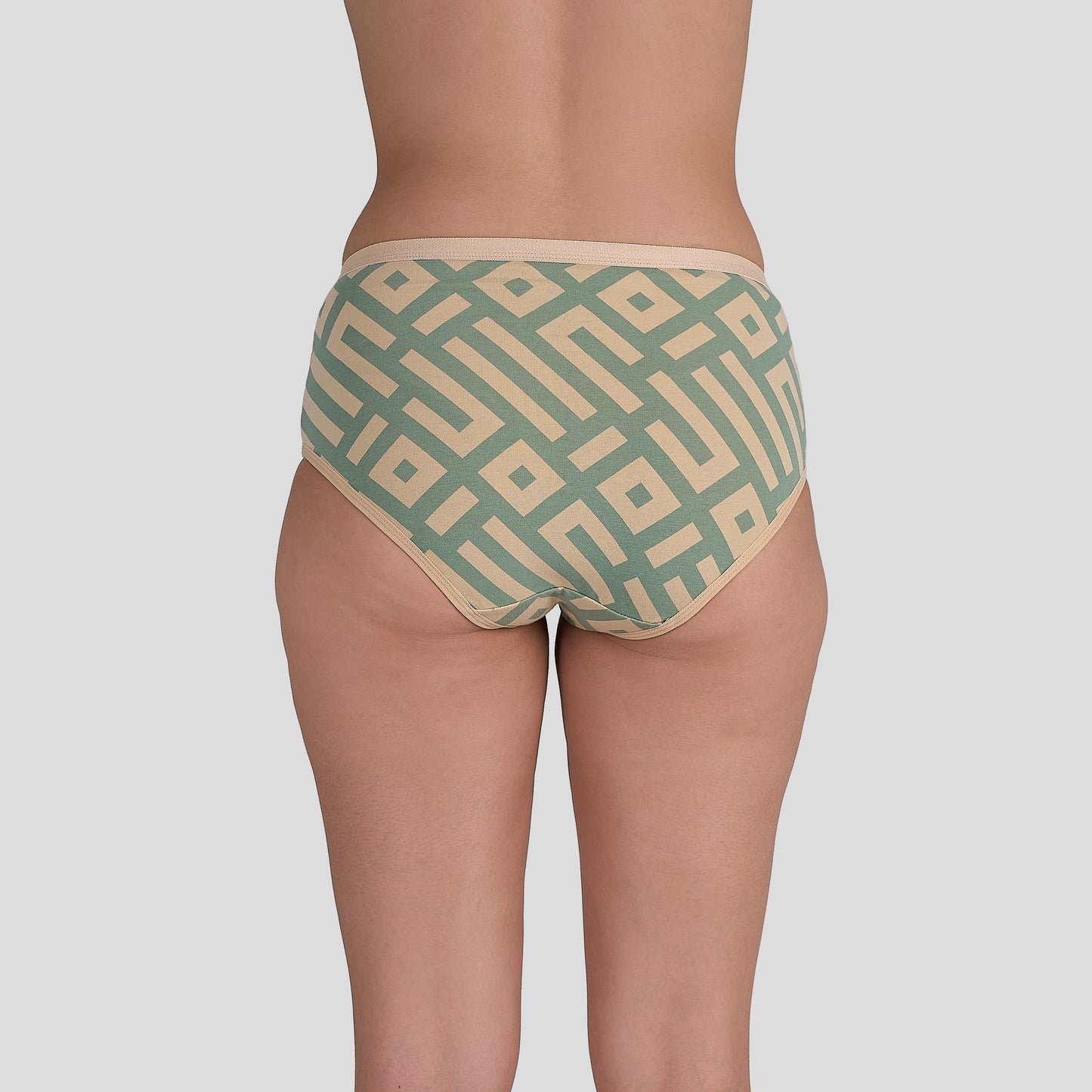 Dice Green and beige patterned underwear on a plain background