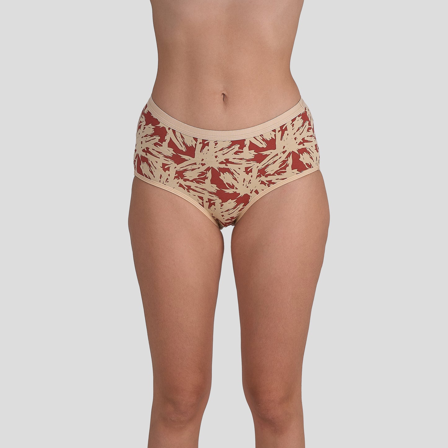 Dice Beige and red patterned underwear on a plain background