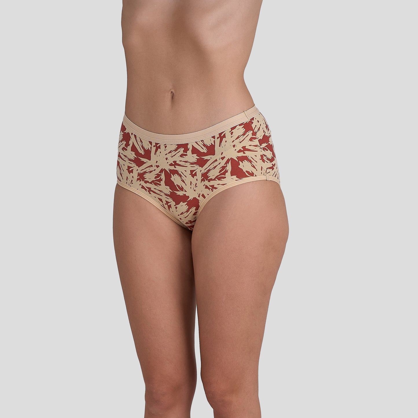 Dice Beige and red patterned underwear on a plain background