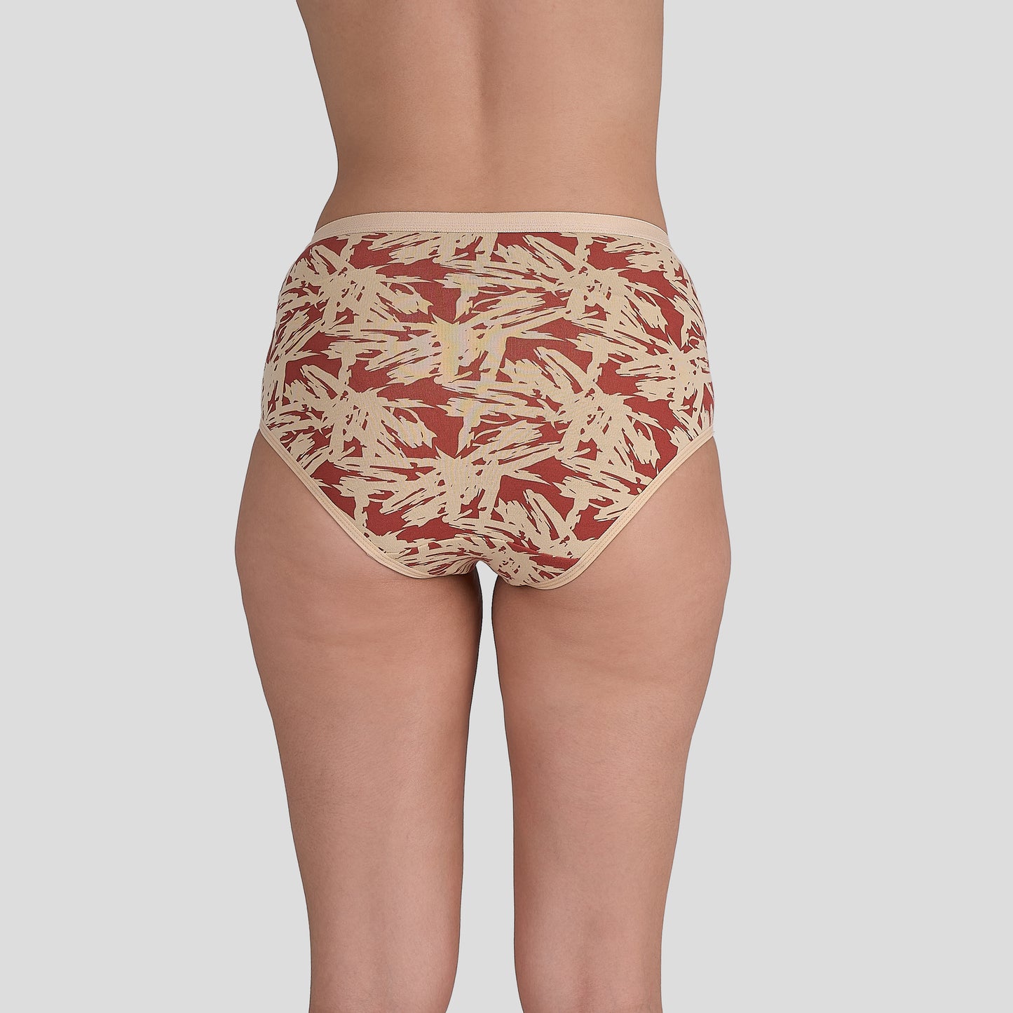 Dice Patterned underwear worn by a person on a plain background