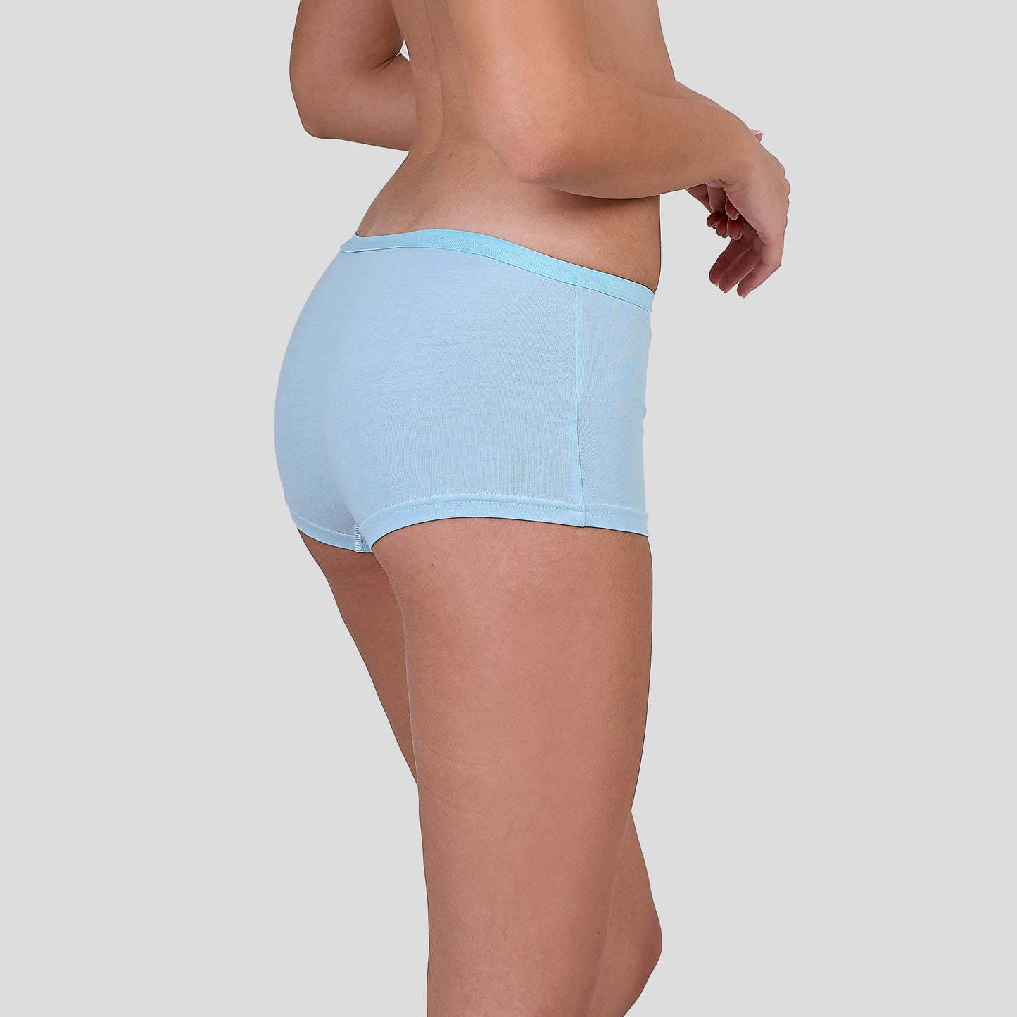 Dice Light blue underwear worn by a person on a plain background