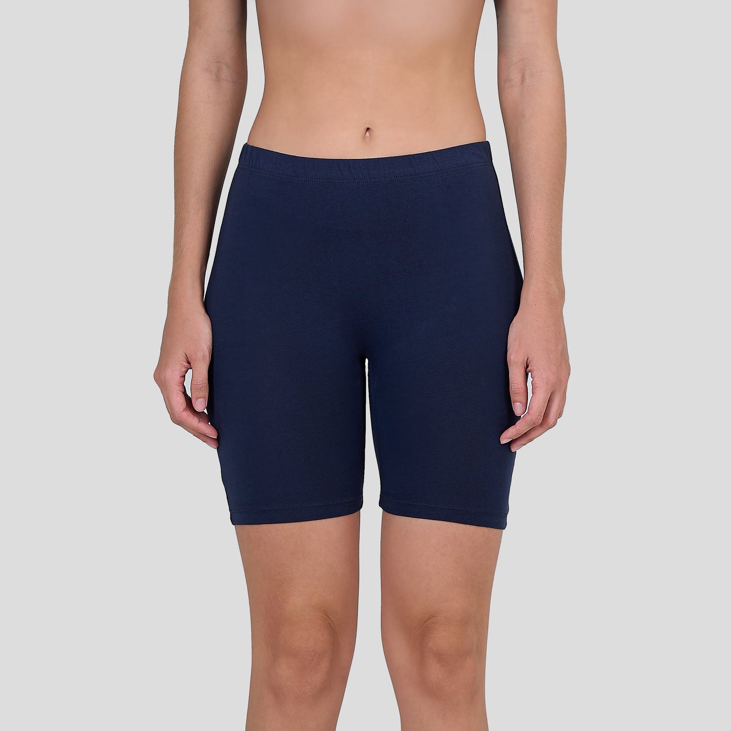 Dice Navy blue athletic shorts worn by a person on a light gray background