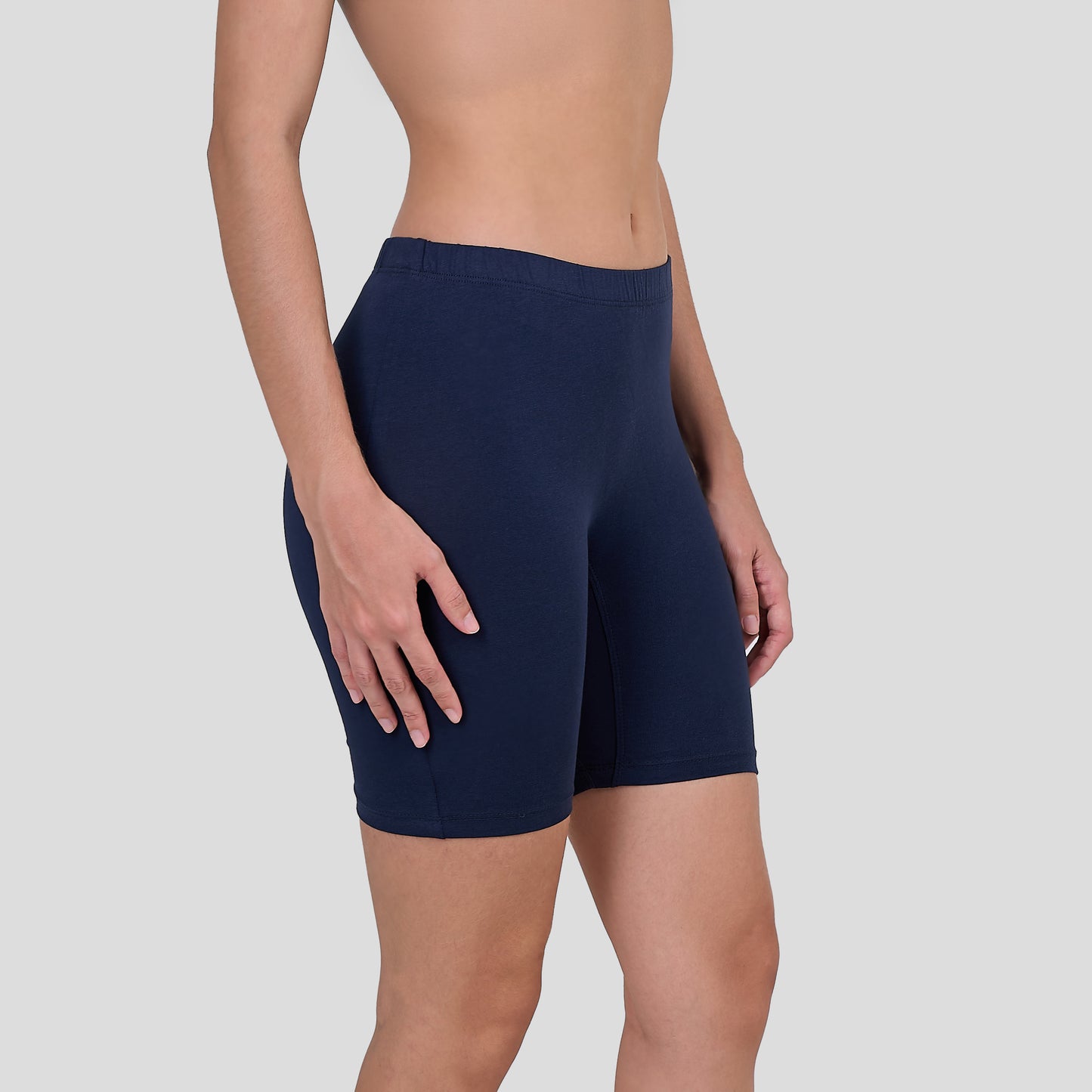 Dice Navy blue athletic shorts worn by a person on a light gray background