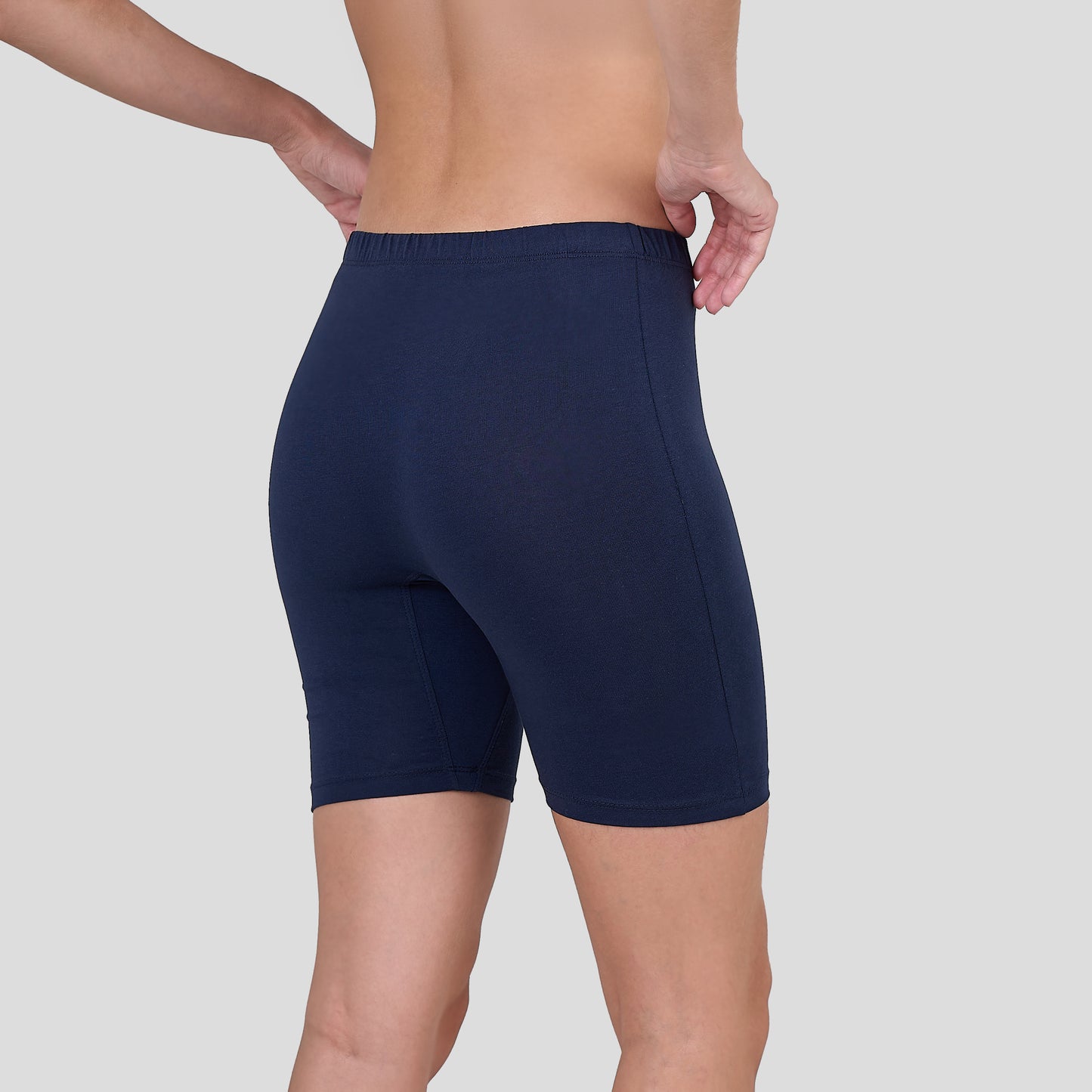 Dice Navy blue athletic shorts worn by a person on a light gray background