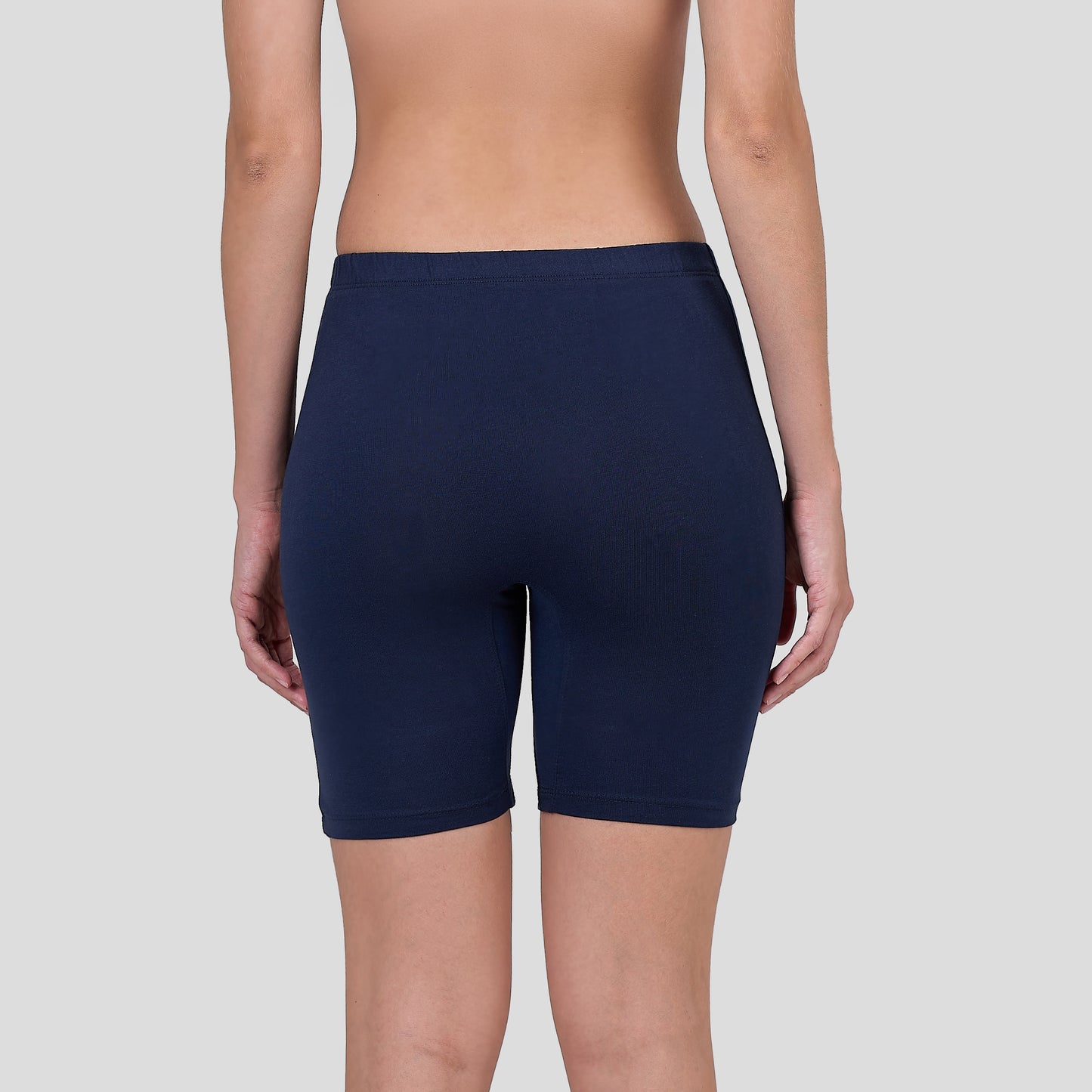 Dice Navy blue athletic shorts worn by a person on a light gray background