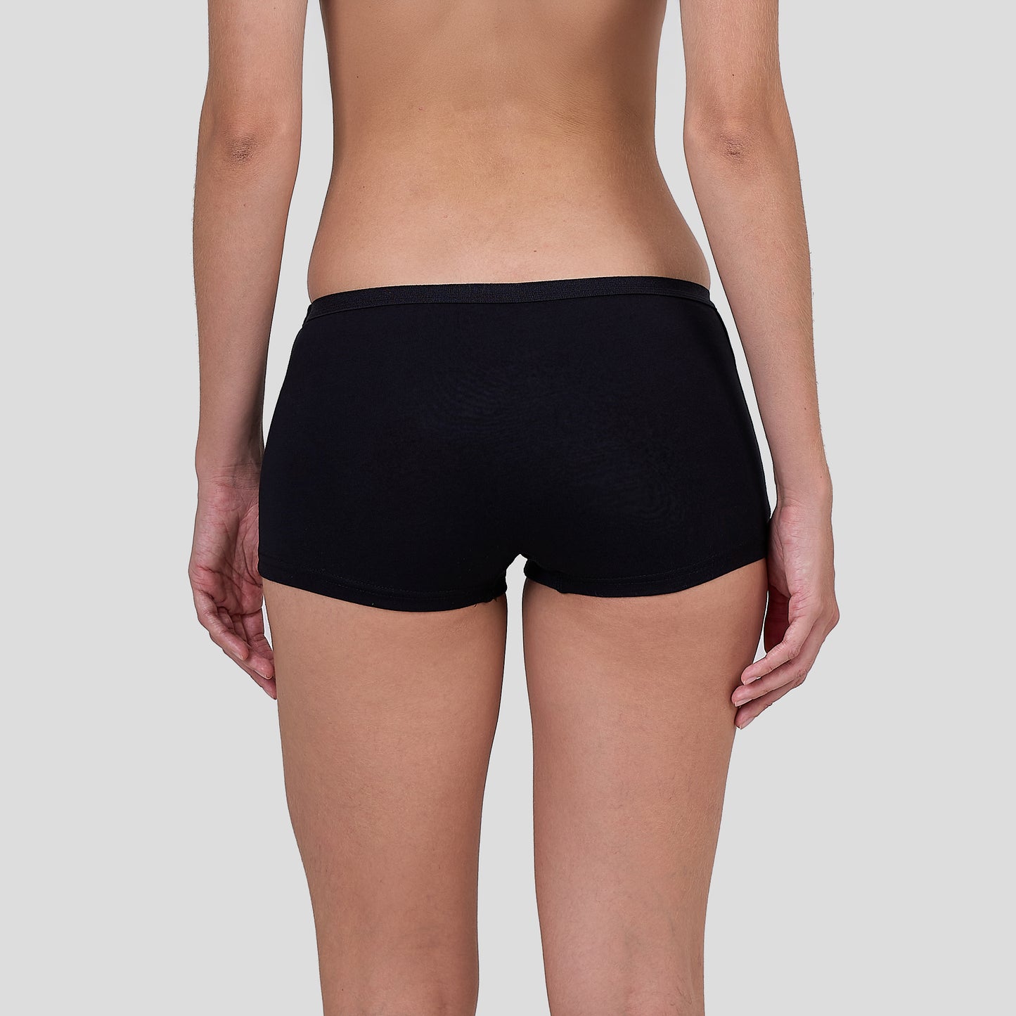 Person wearing Dice black underwear on a plain background