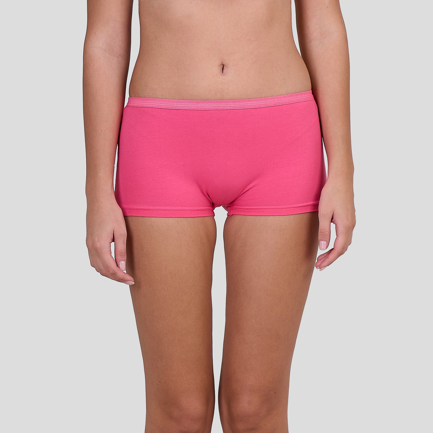 Person wearing a Dice bright pink underwear on a plain background