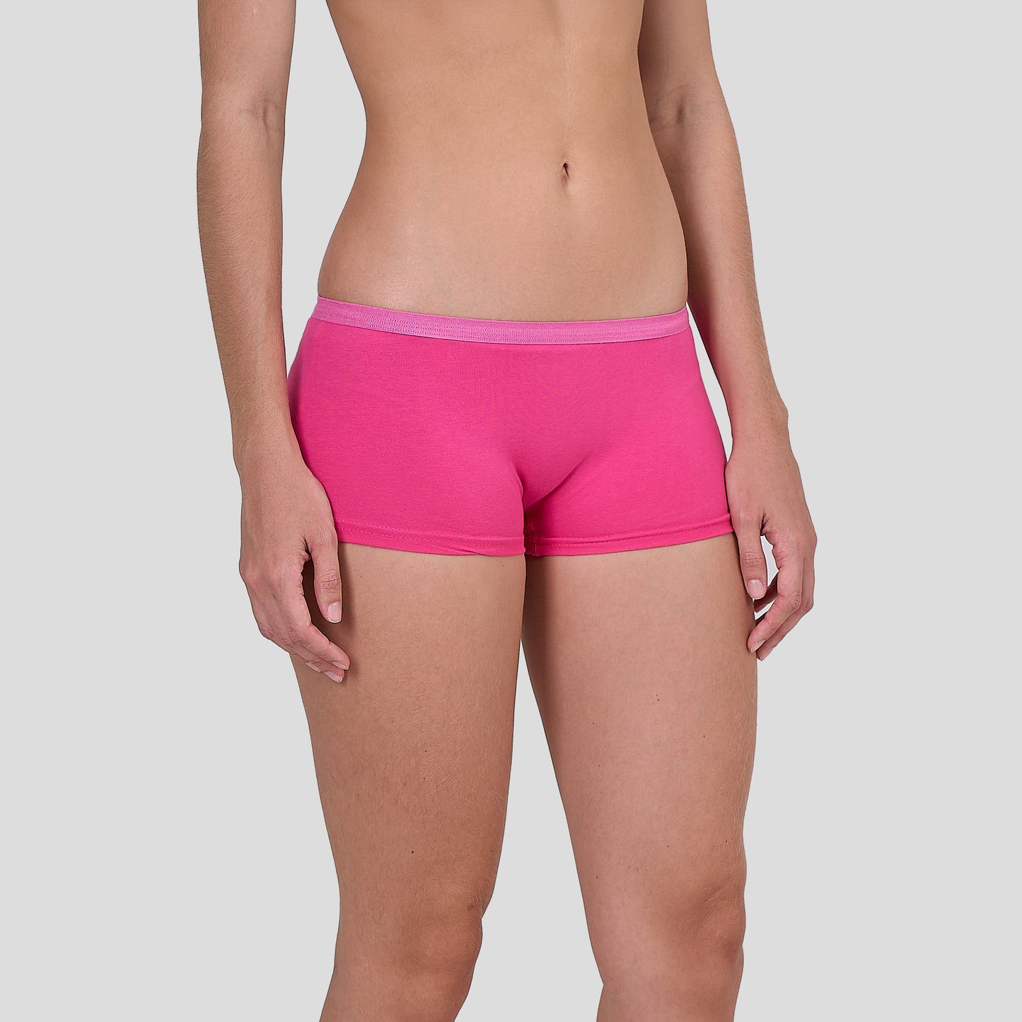 Person wearing a Dice bright pink underwear on a plain background