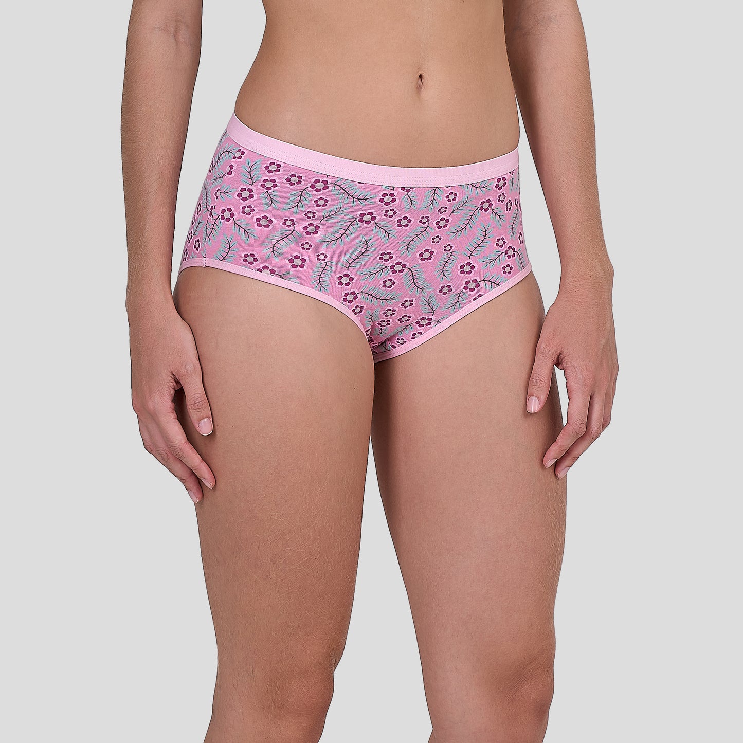 Dice Pink floral-patterned underwear worn by a person on a light gray background