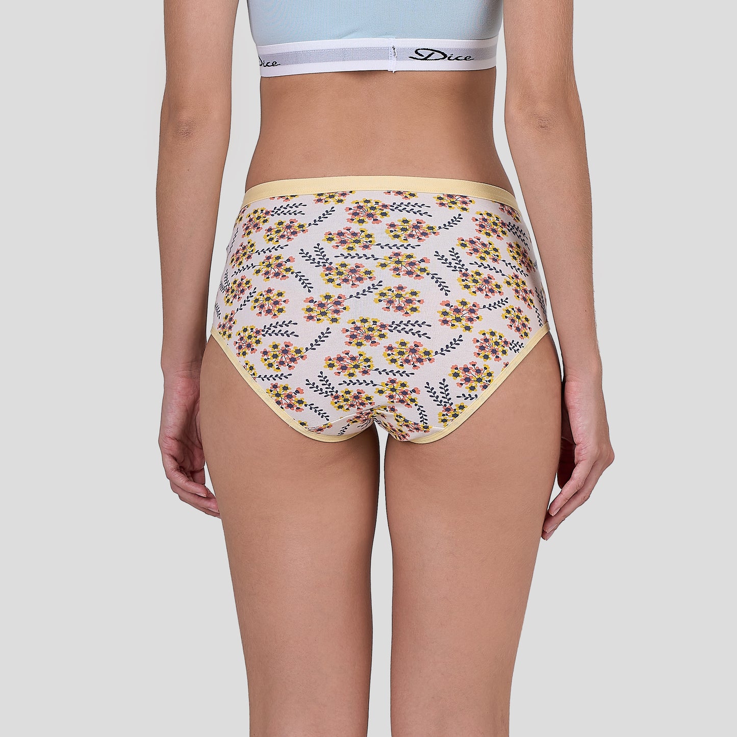 Dice Floral-patterned underwear worn by a person on a plain background