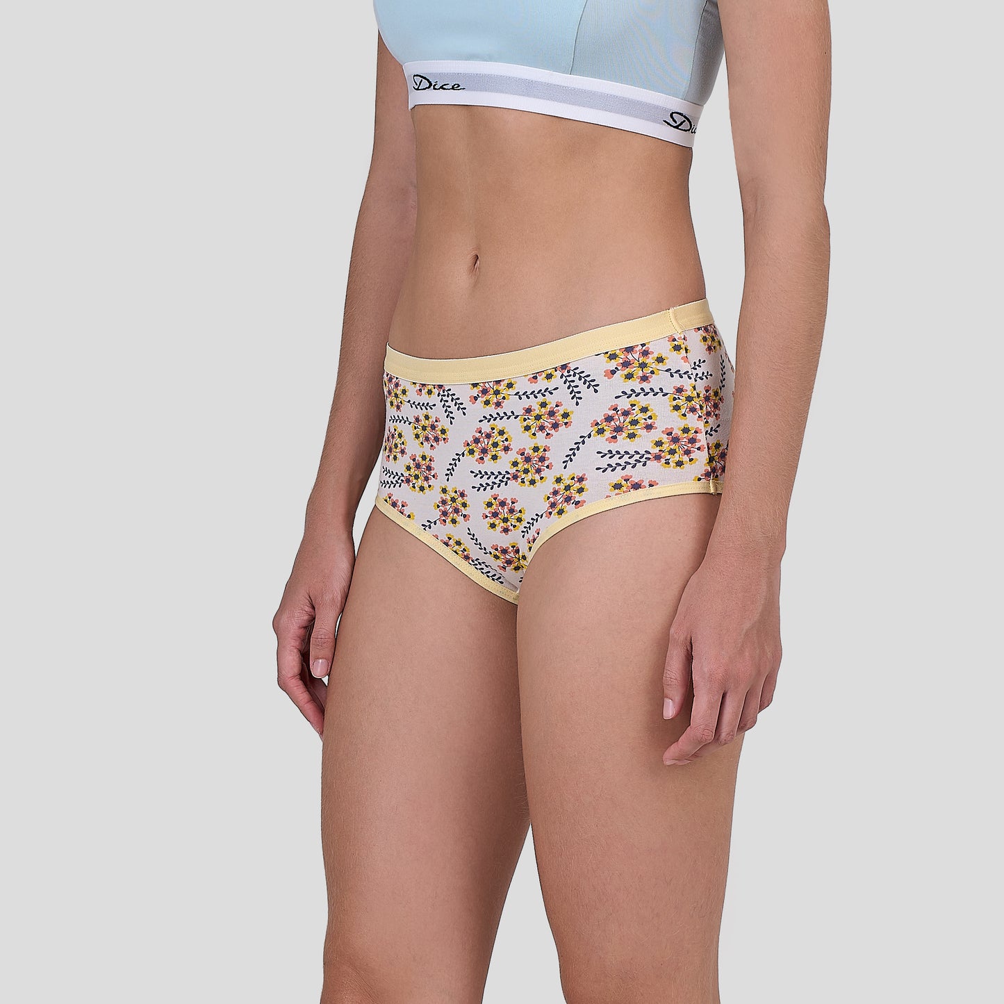 Dice Floral-patterned underwear worn by a person on a plain background