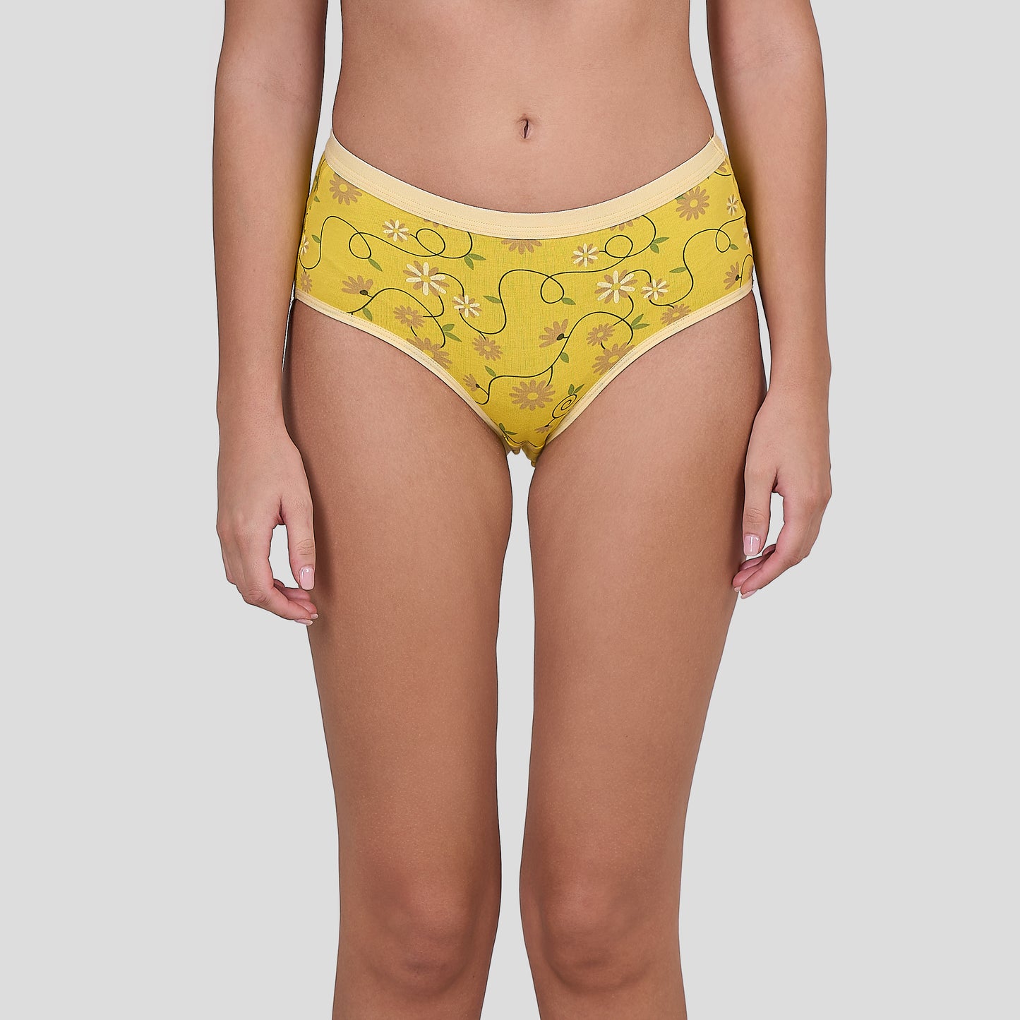 Dice Yellow patterned underwear worn by a person on a plain background