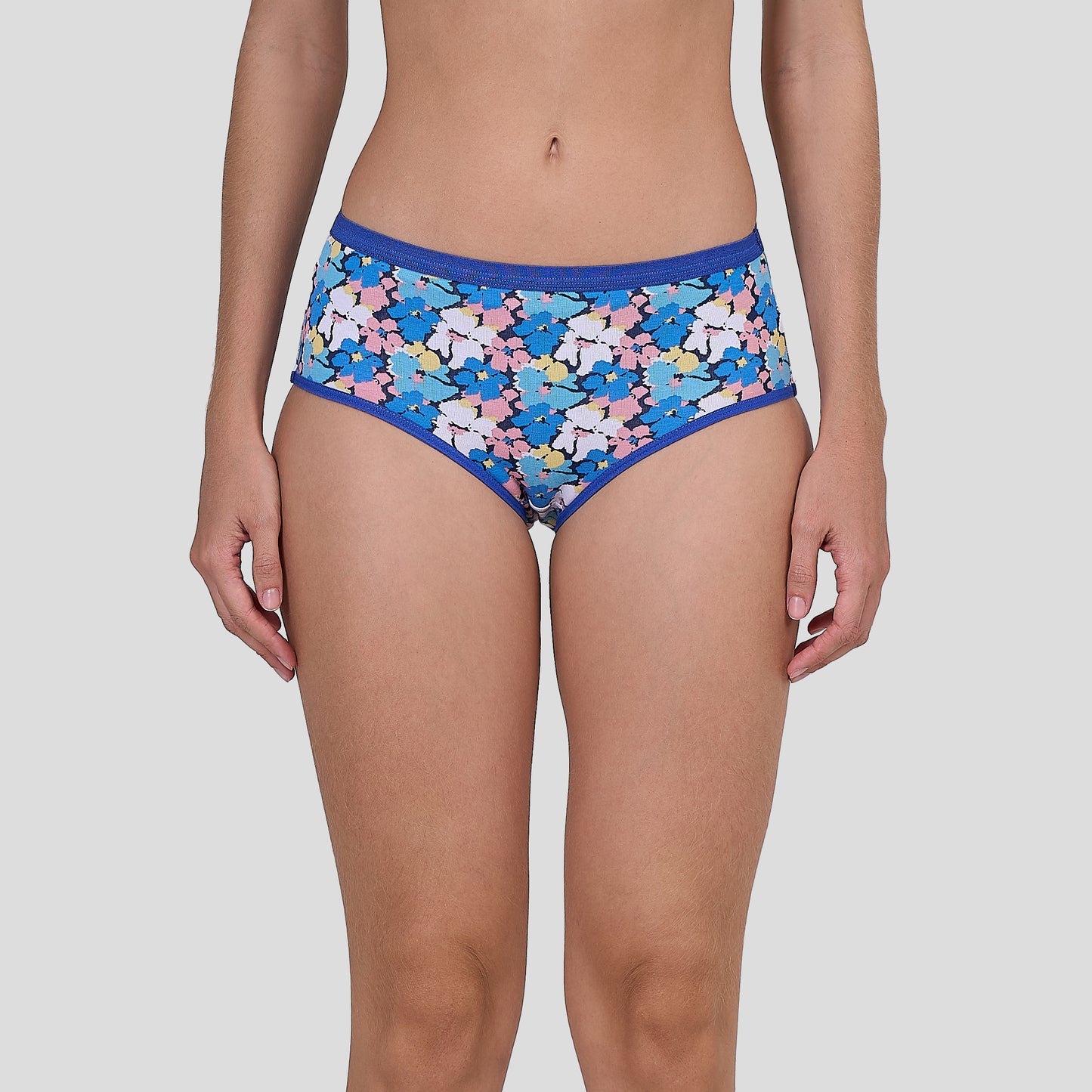 Dice Multicolored patterned underwear worn by a person on a plain background