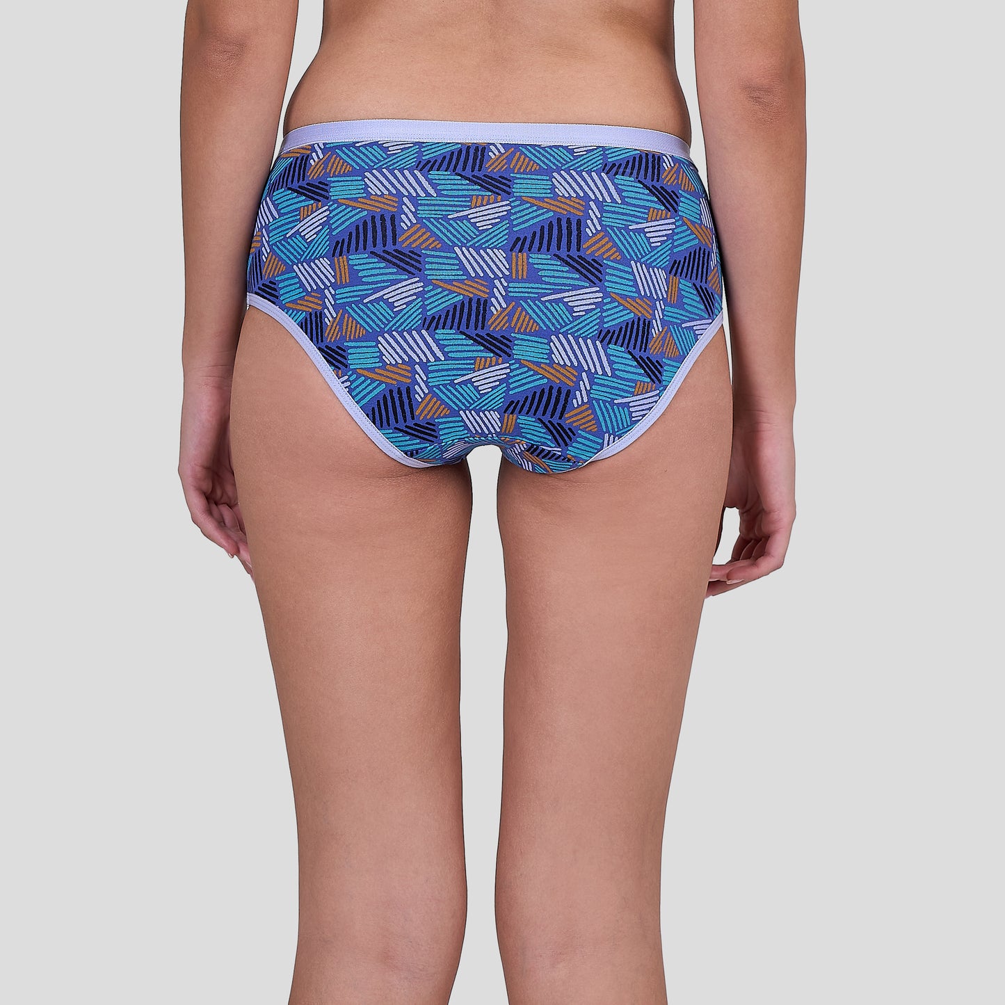 Dice Blue patterned underwear worn by a person on a plain background