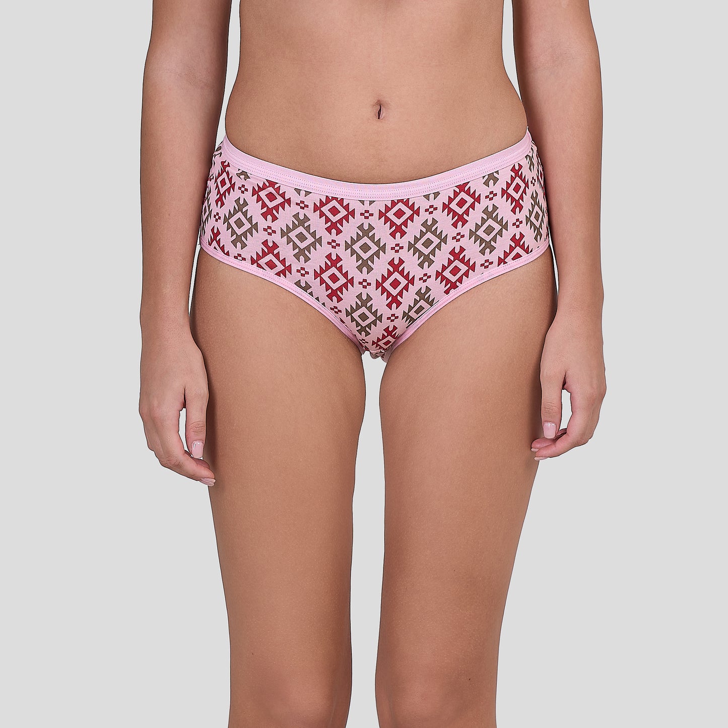 Person wearing a Dice pink patterned underwear on a plain background
