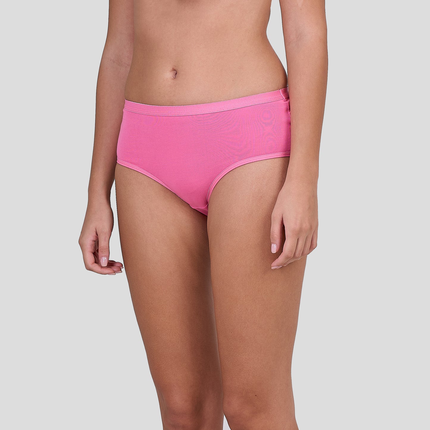 Person wearing Dice bright pink underwear on a light gray background
