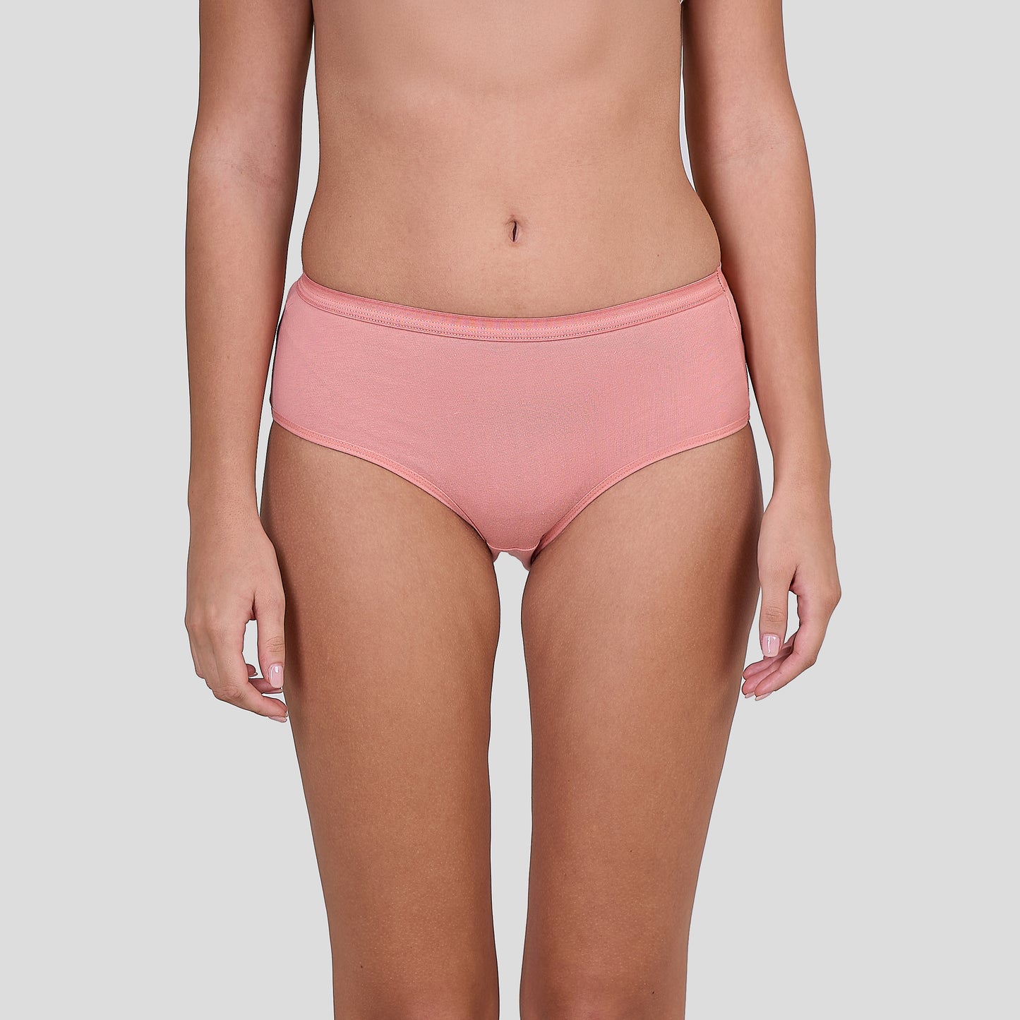 Person wearing a Dice pink high-waisted underwear on a plain background