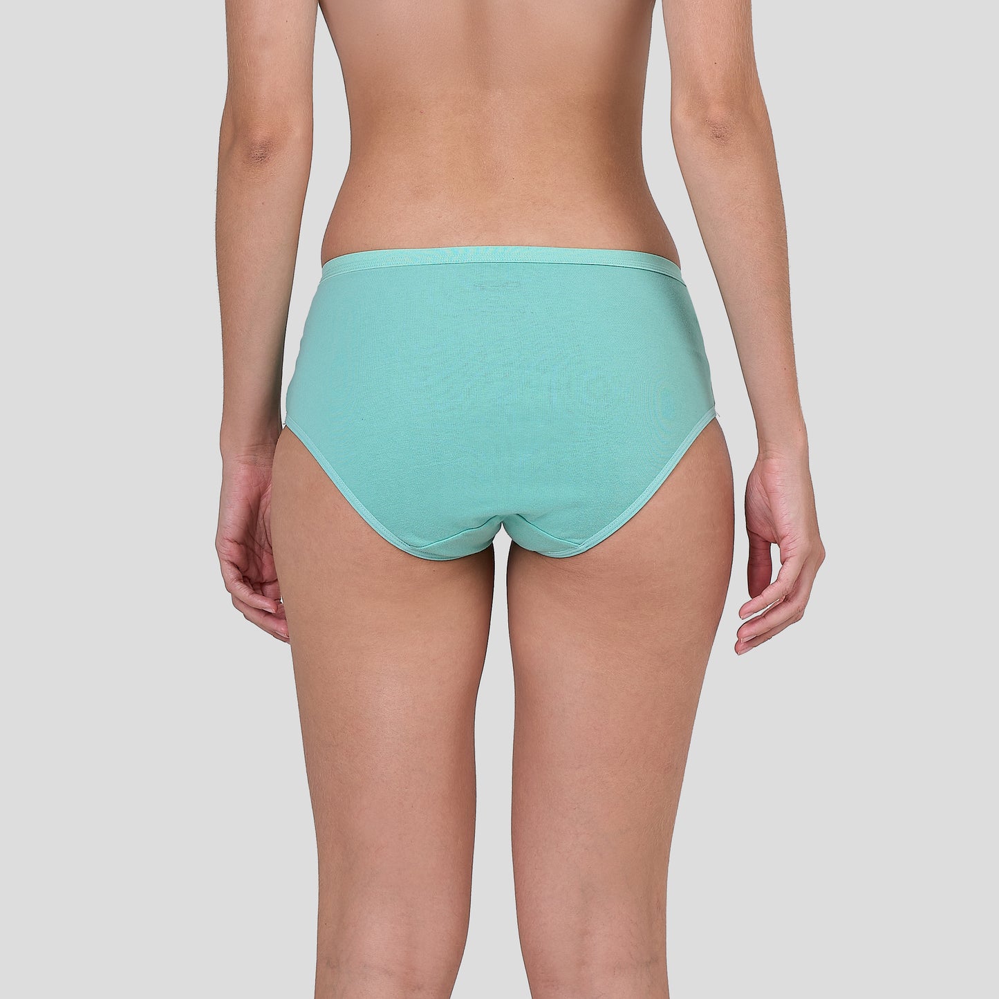 Person wearing a Dice teal underwear on a plain background