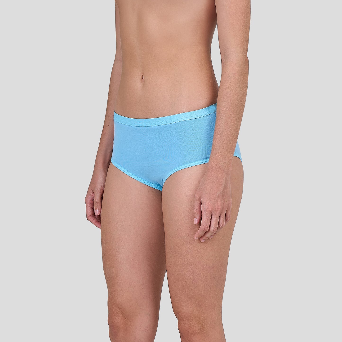 Person wearing Dice light blue bikini bottoms on a plain background