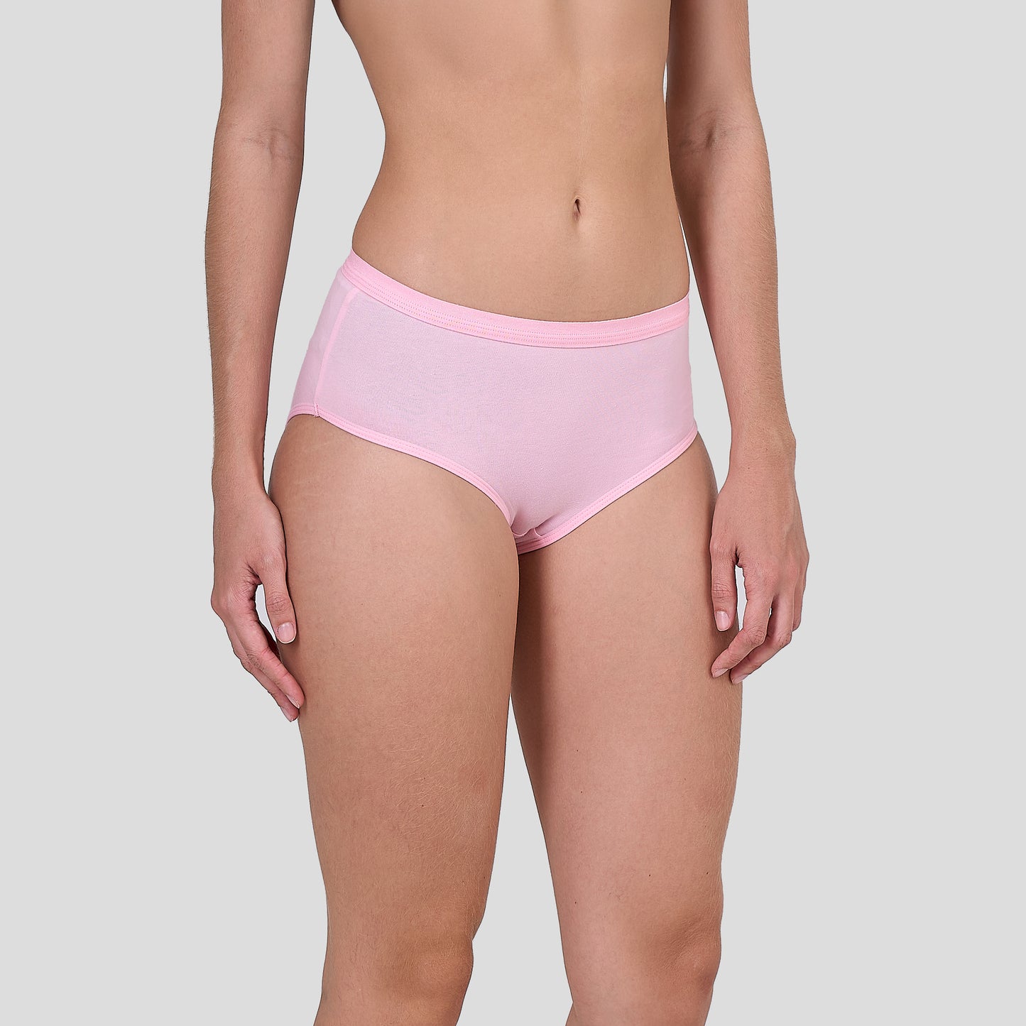 Person wearing a Dice pink underwear on a plain background