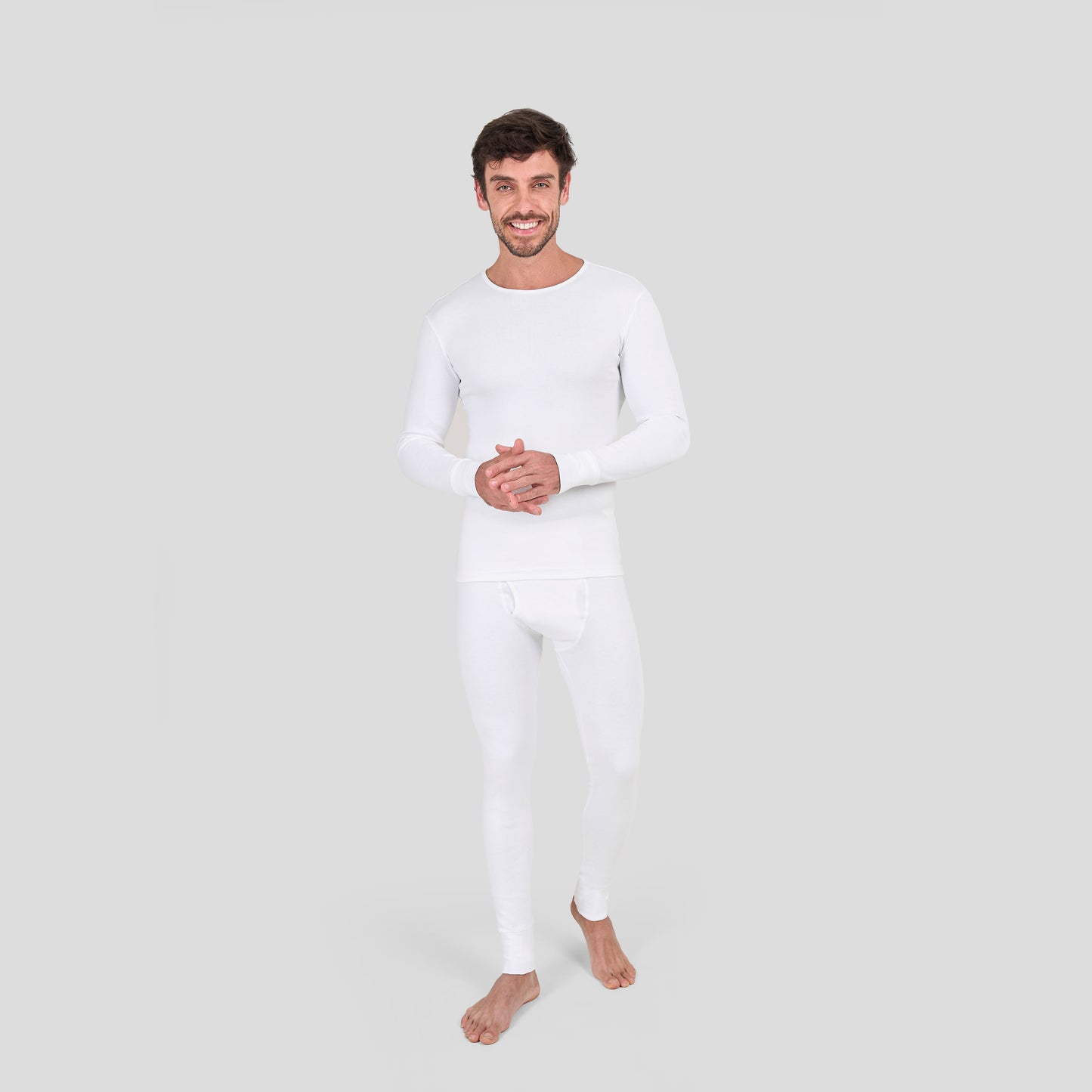 Man wearing Dice white long-sleeve shirt and pants on a light gray background