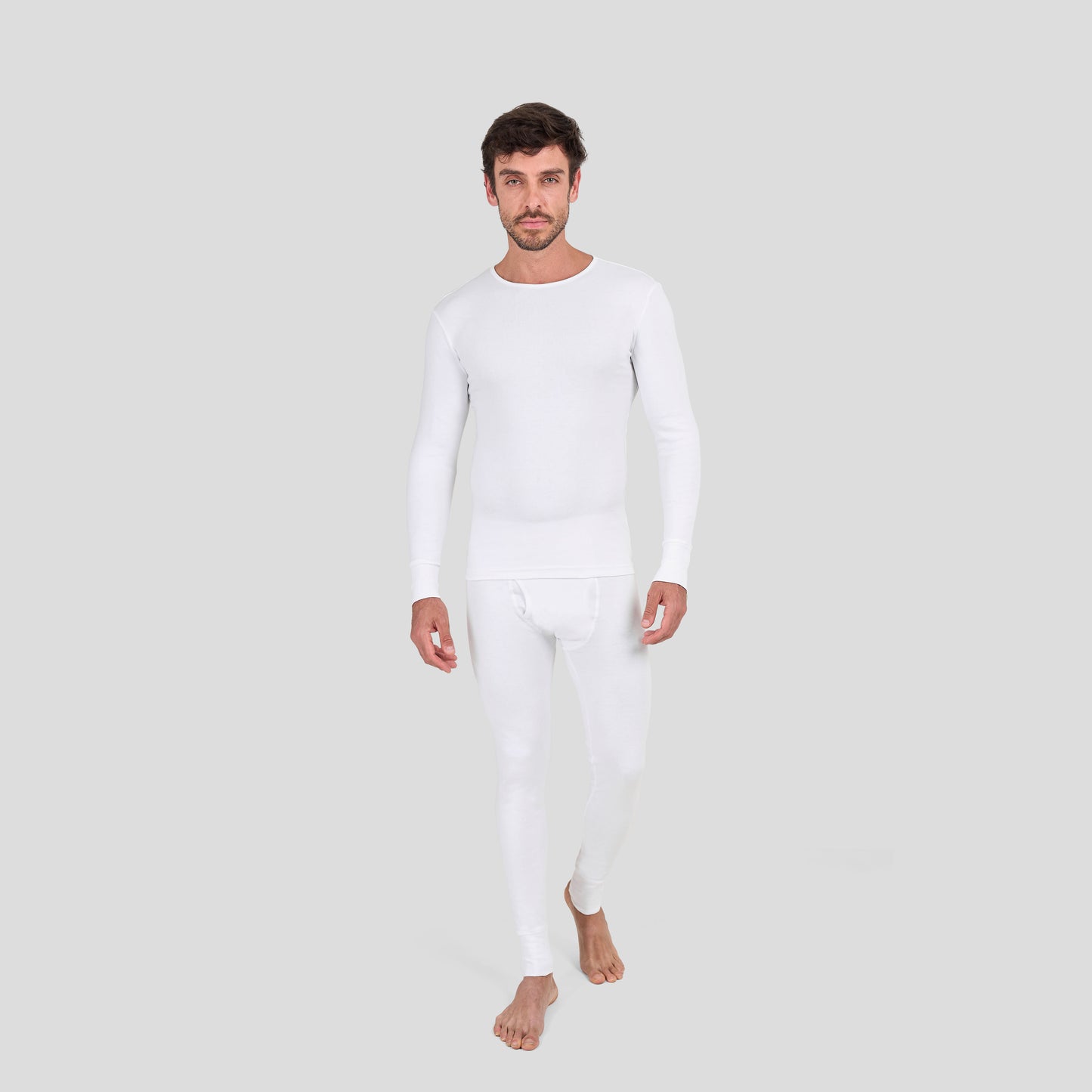 Man wearing Dice white long-sleeve shirt and pants on a light gray background