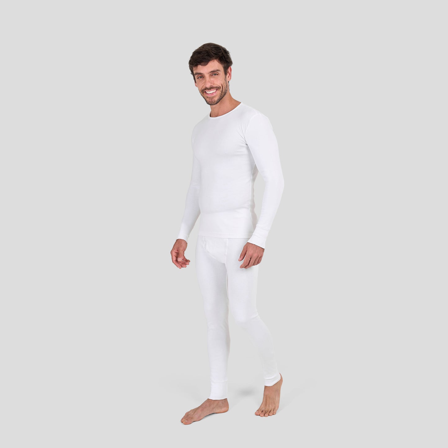 Man wearing Dice white thermal underwear set on a light gray background