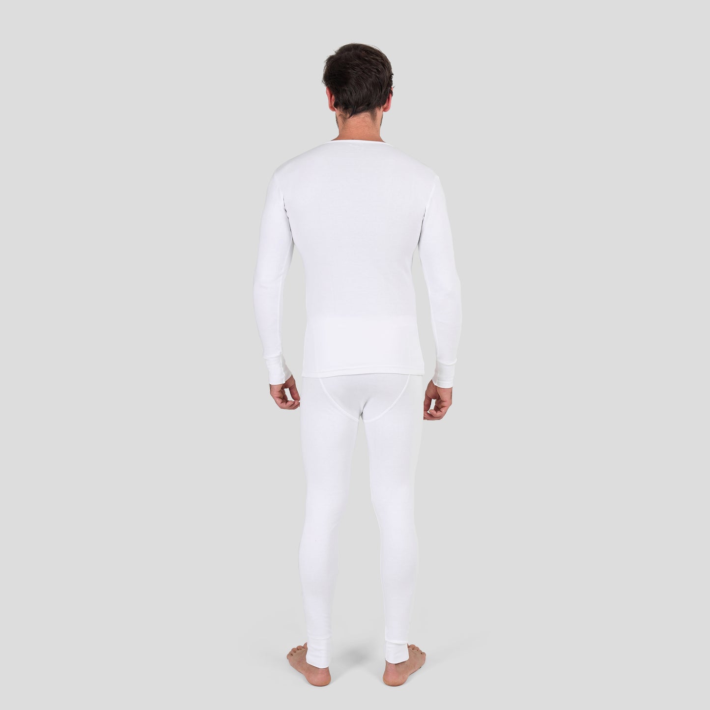 Man wearing Dice white long-sleeve shirt and pants on a light gray background