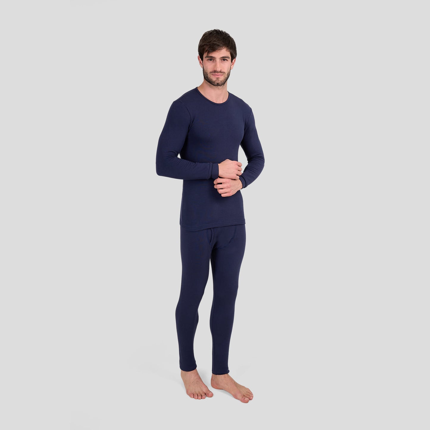 Man wearing Dice navy blue thermal outfit on a light gray background