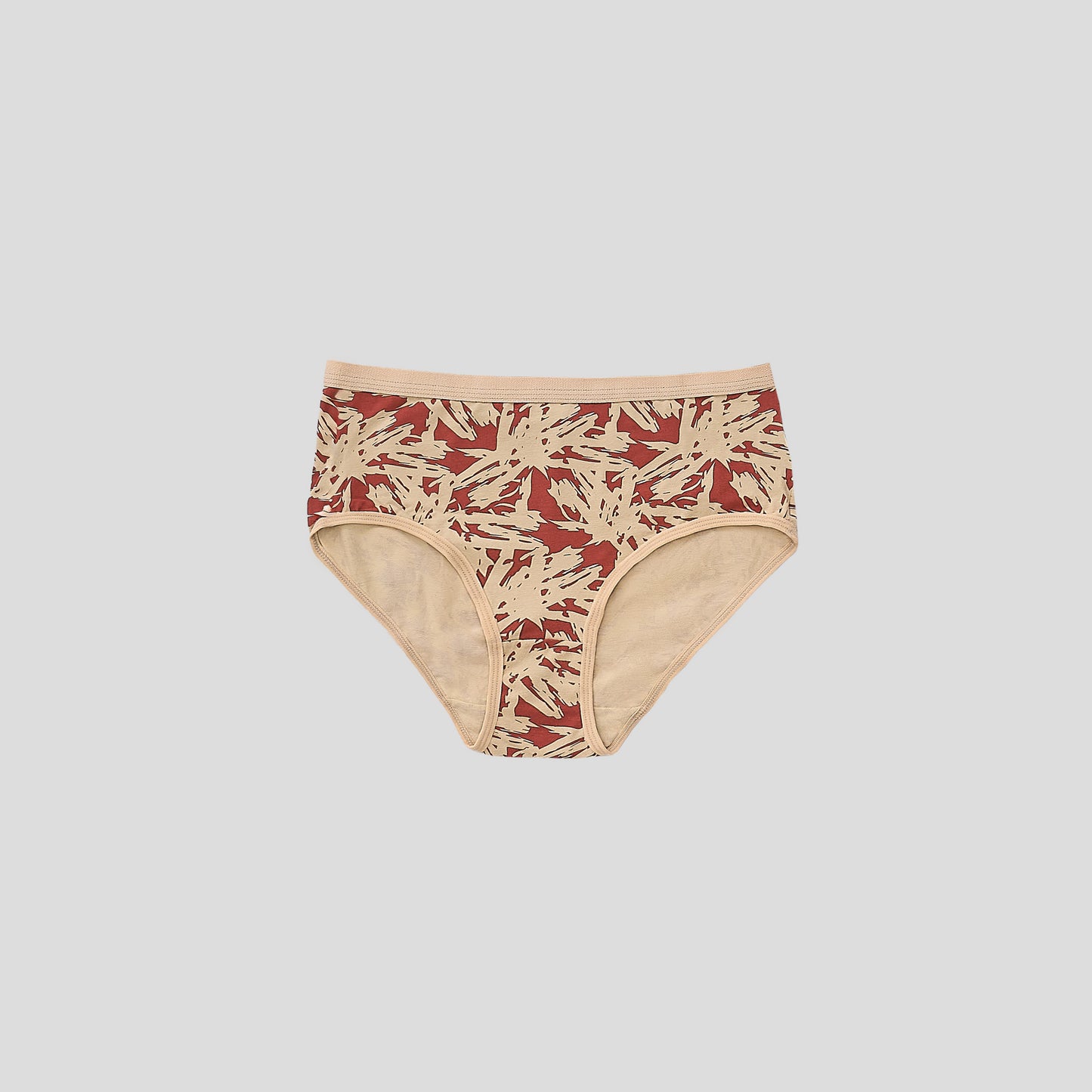 Dice Beige and red patterned underwear on a light gray background