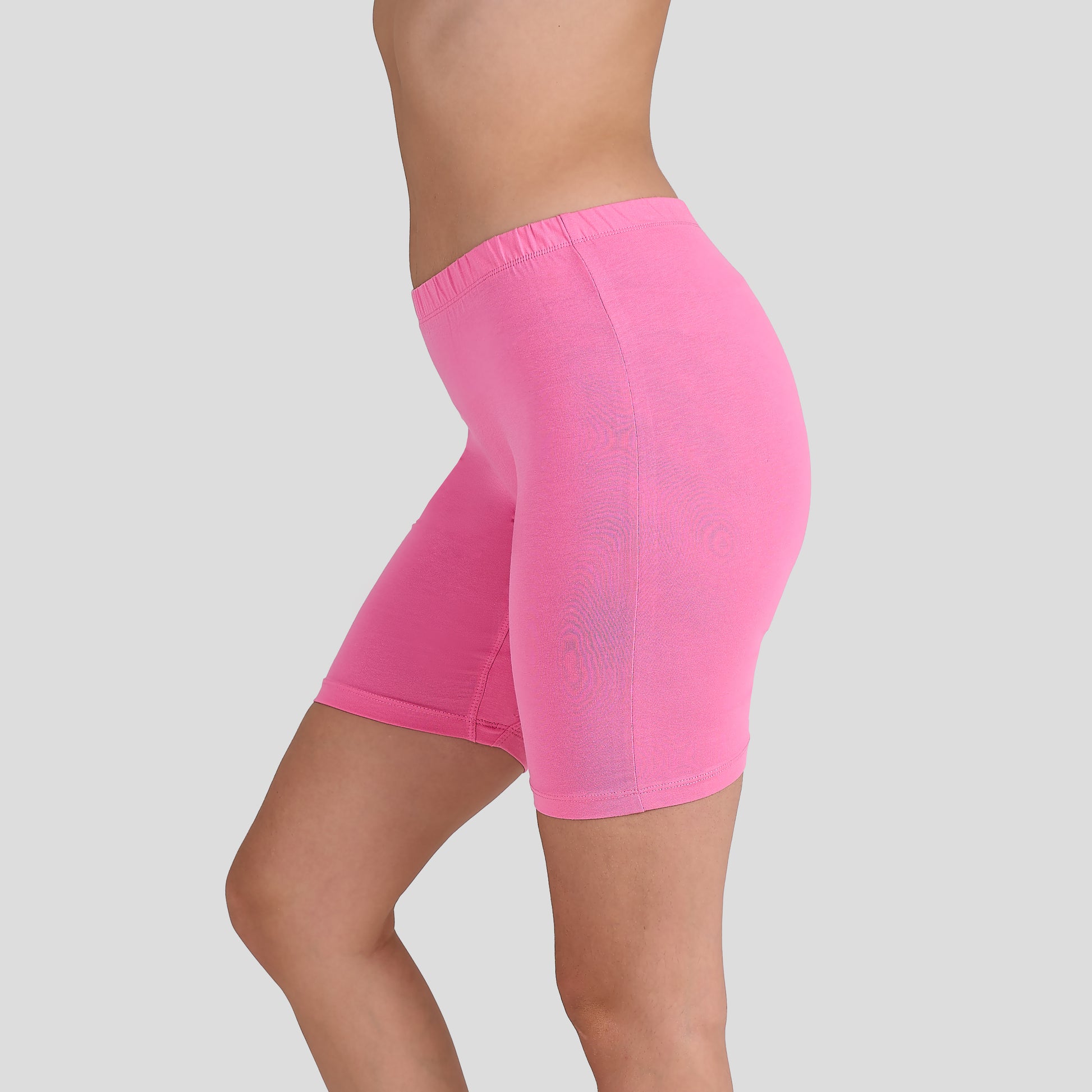 Dice Pink athletic shorts worn by a person on a light gray background
