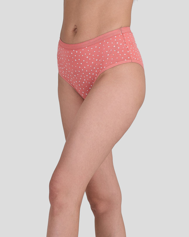 Person wearing a Dice pink polka dot underwear on a light gray background