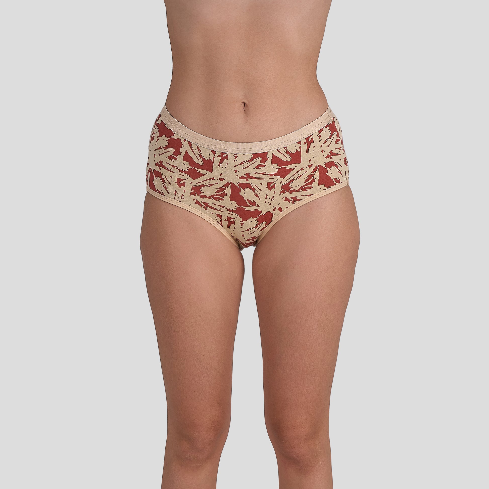 Dice Beige and red patterned underwear on a plain background