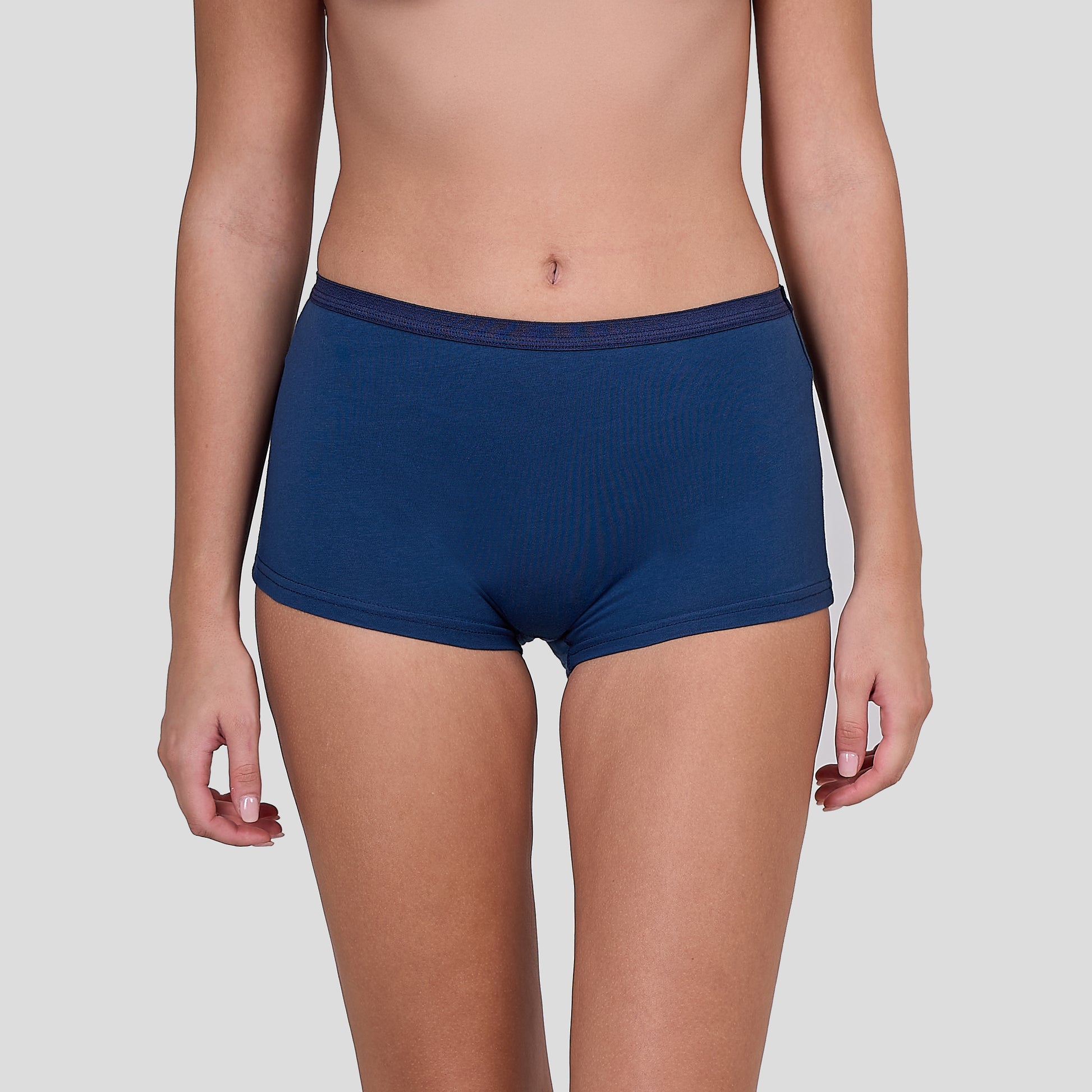 Person wearing a Dice blue underwear on a plain background